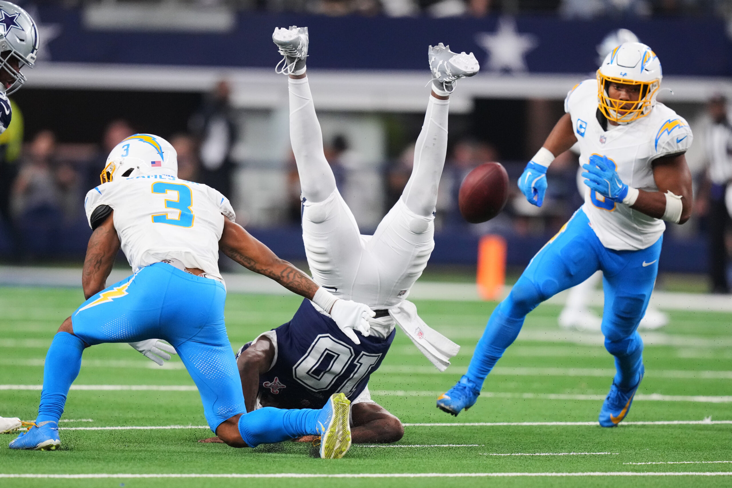 Dallas Cowboys quarterback Joe Milton (10) fumbles as he is...