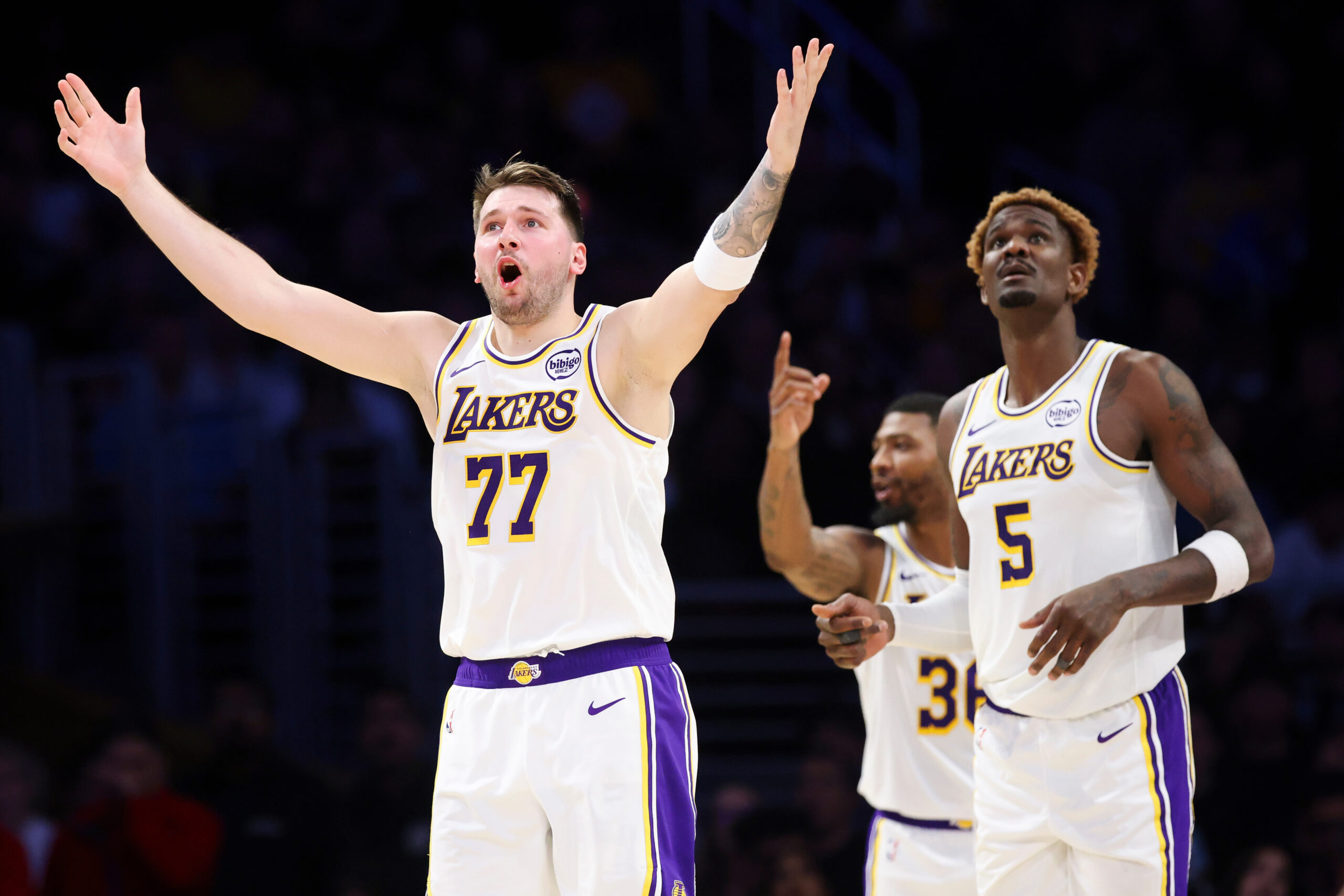 Lakers guard Luka Doncic (77) reacts to a call as...