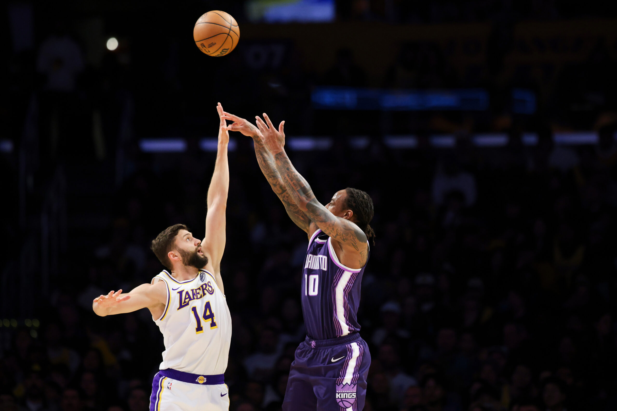 Sacramento Kings guard Demar Derozan (10) shoots against Lakers forward...
