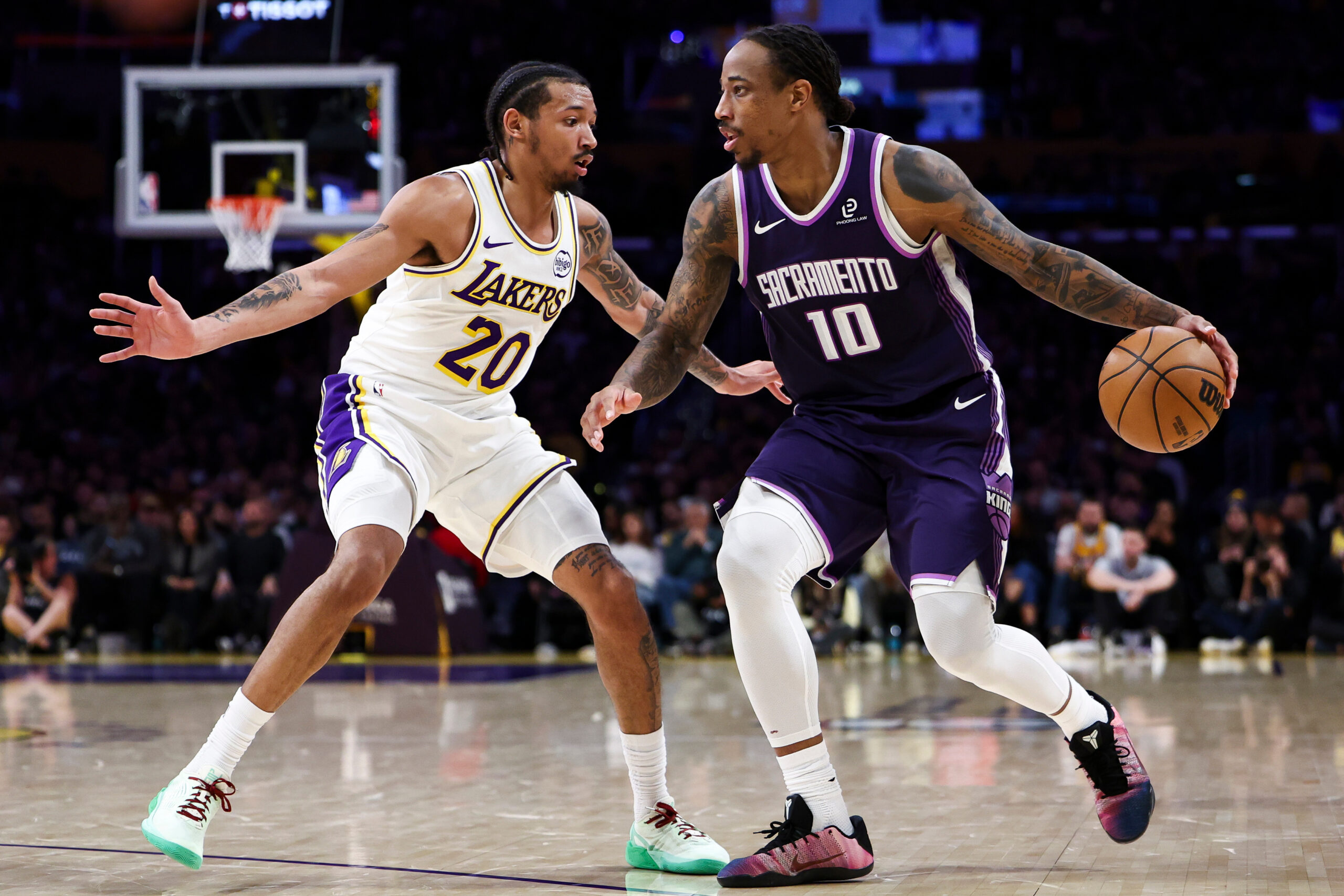 Sacramento Kings guard Demar Derozan (10) dribbles against Lakers guard...