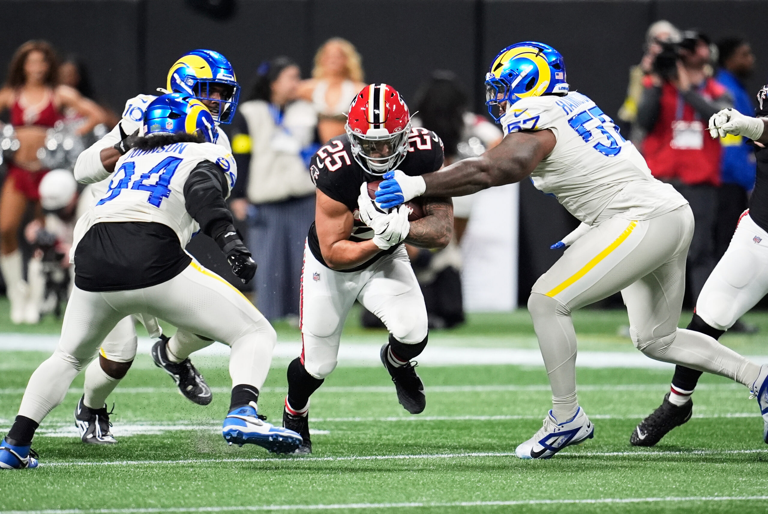 Atlanta Falcons running back Tyler Allgeier (25) carries between Los...