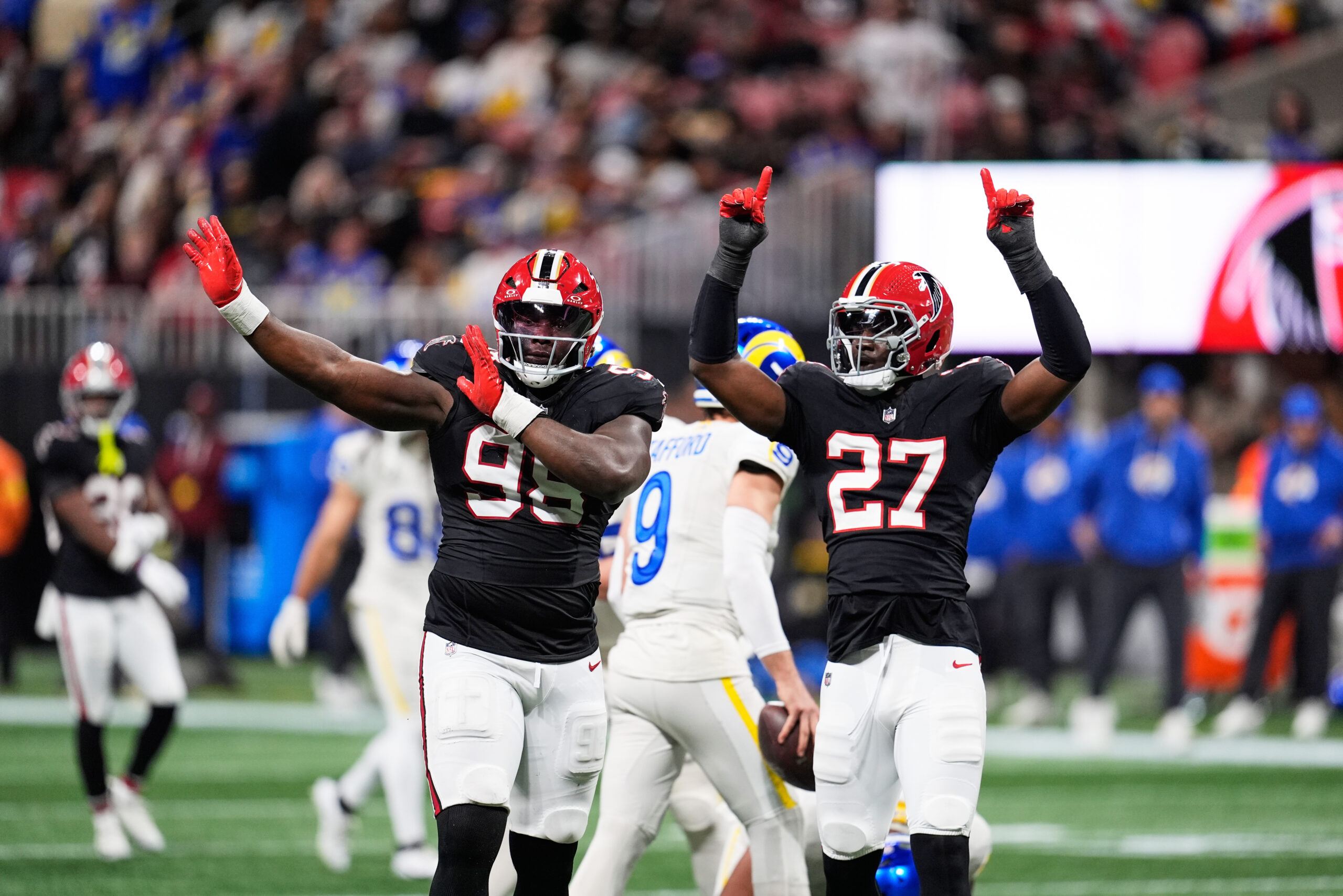 Atlanta Falcons defensive tackle Ruke Orhorhoro (98) celebrates his sack...