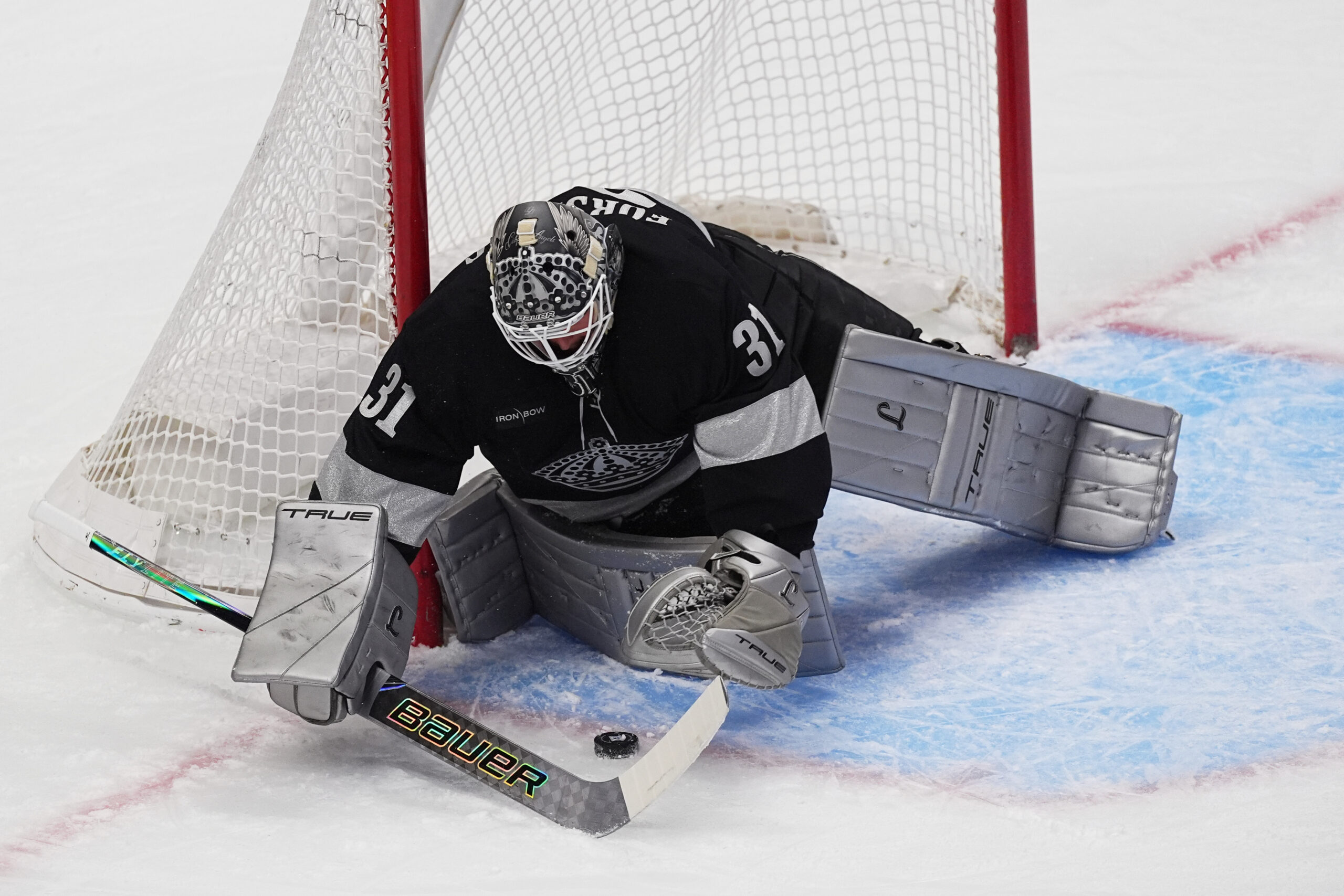 Kings goaltender Anton Forsberg stops a shot in the first...