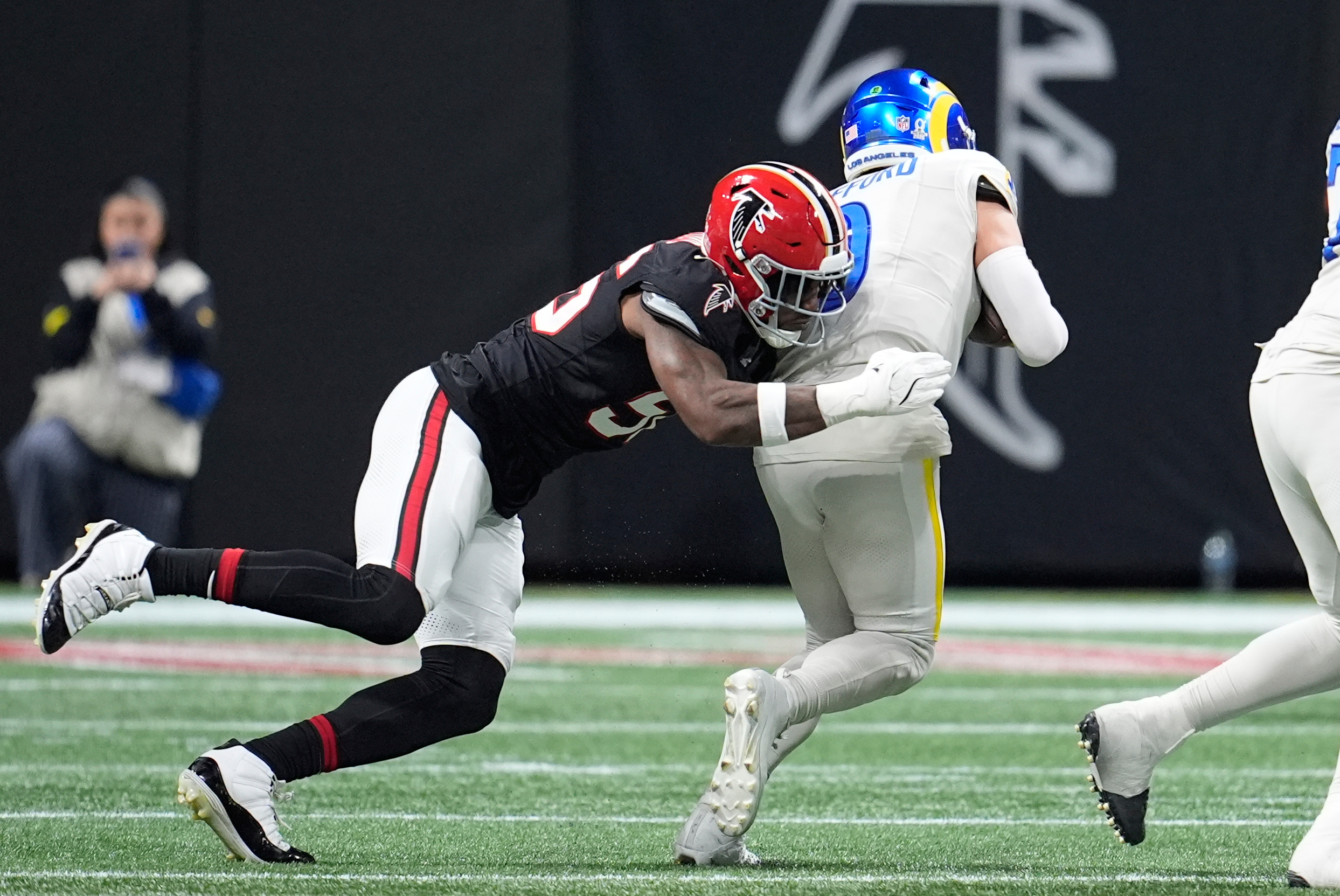 Atlanta Falcons defensive end Leonard Floyd (56) sacks Rams quarterback...