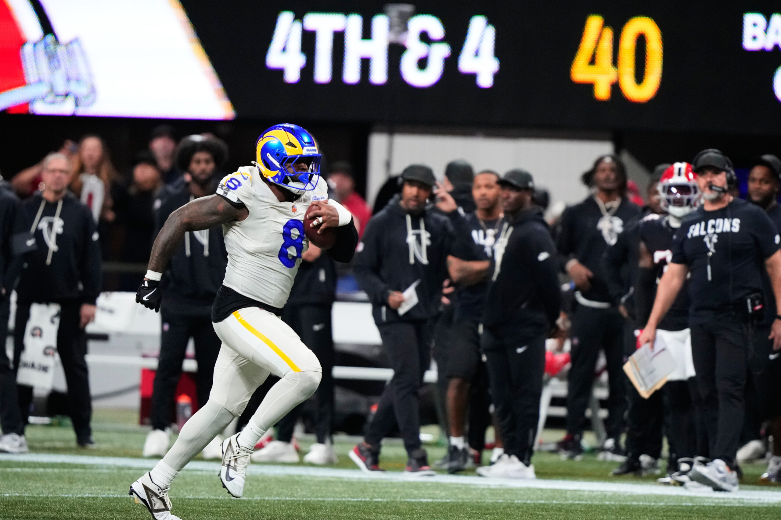 Rams linebacker Jared Verse (8) returns a blocked punt for...