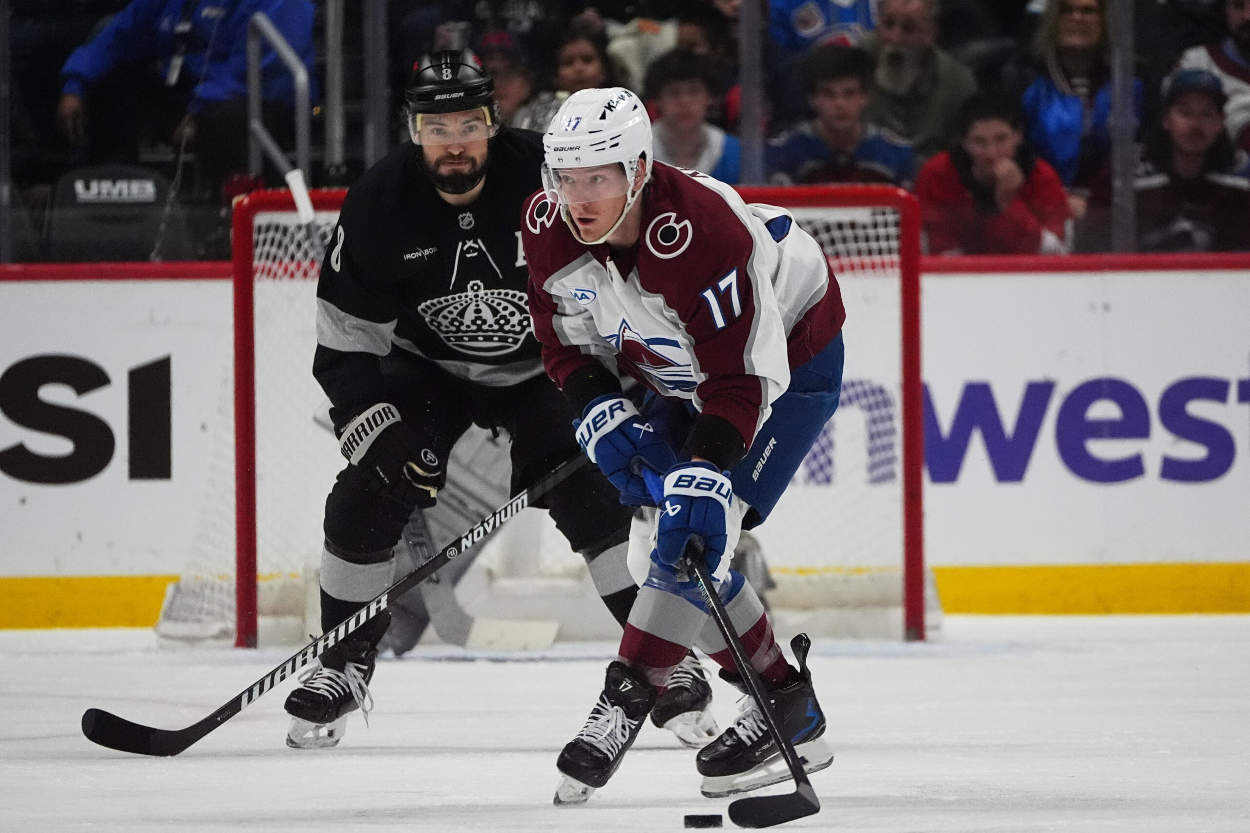 Colorado Avalanche center Parker Kelly, front, collects the puck as...