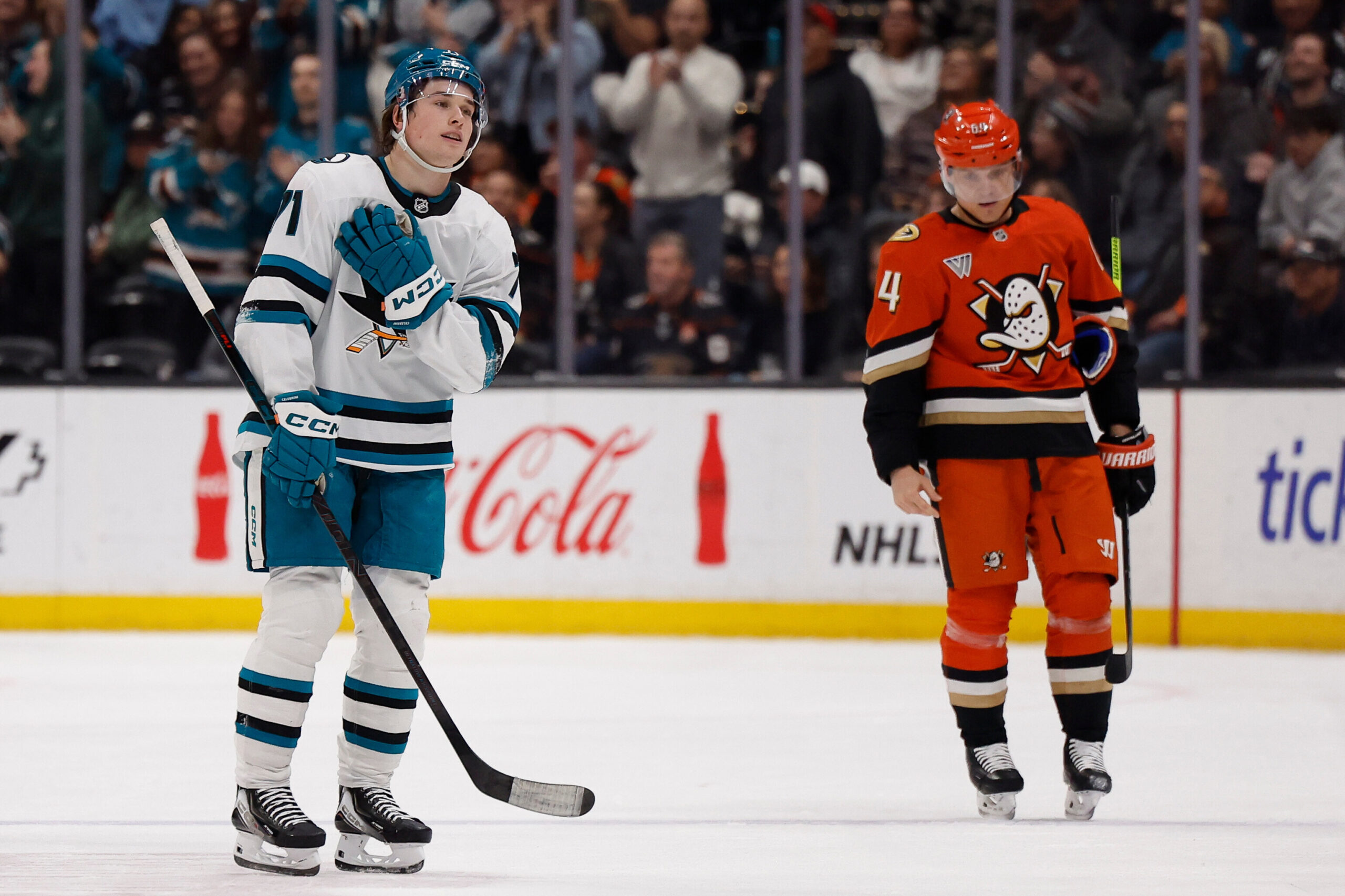 San Jose Sharks center Macklin Celebrini, left, reacts after scoring...