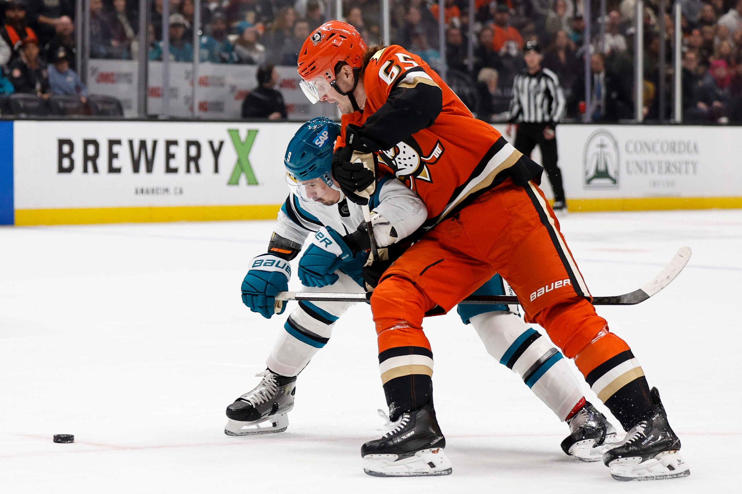 San Jose Sharks defenseman Dmitry Orlov (9) and Anaheim Ducks...