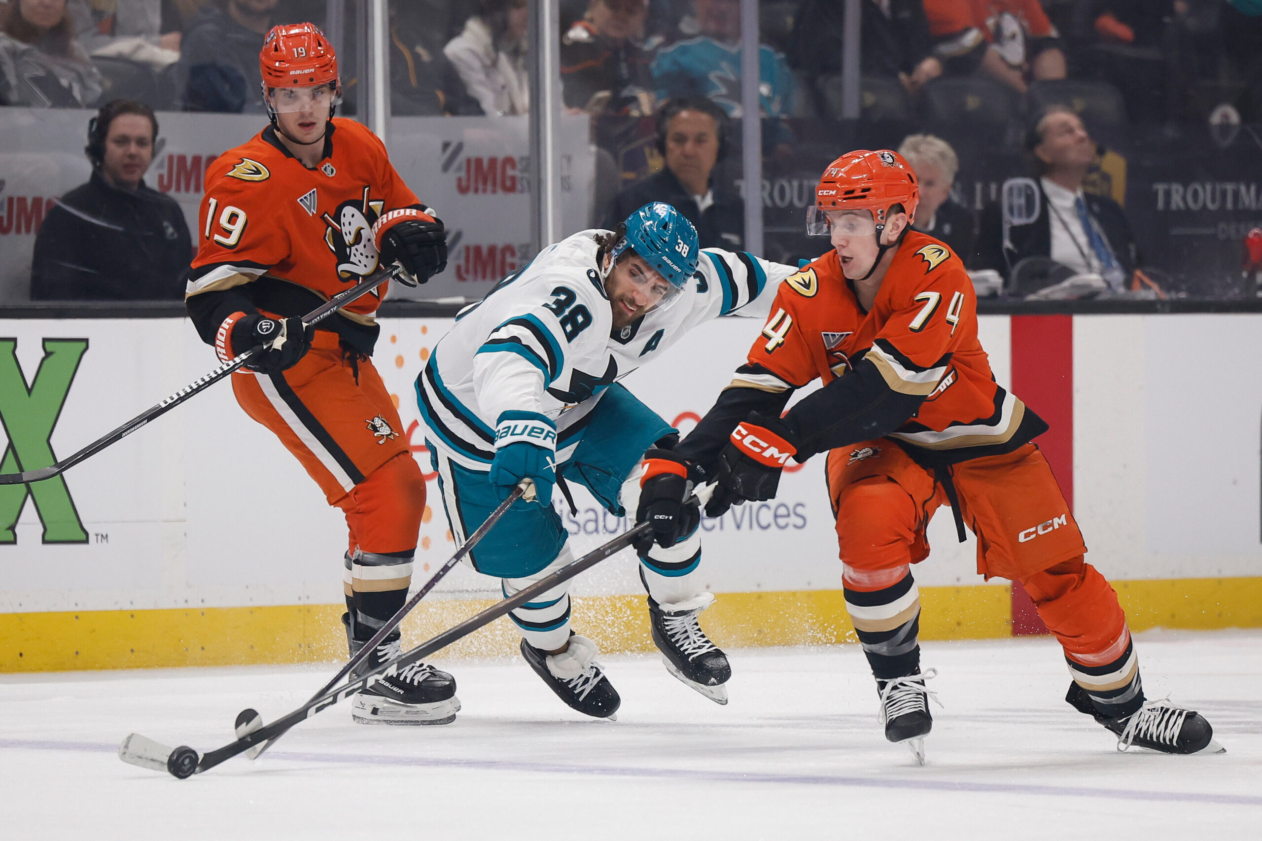 San Jose Sharks defenseman Mario Ferraro (38) and Anaheim Ducks...