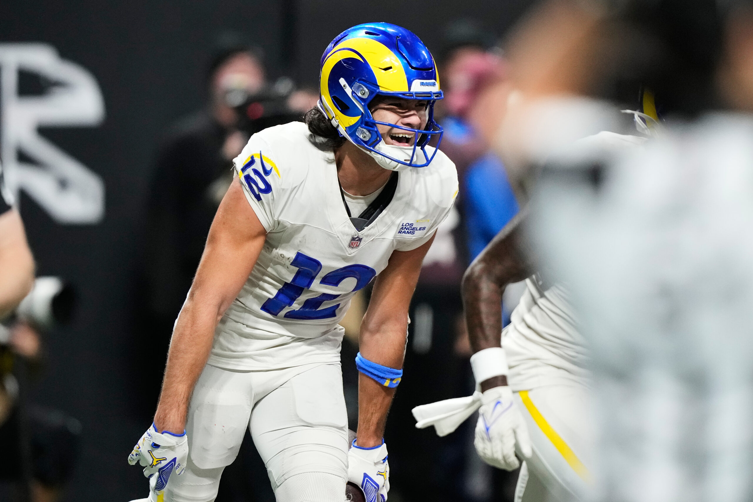 Rams wide receiver Puka Nacua (12) celebrates his touchdown in...