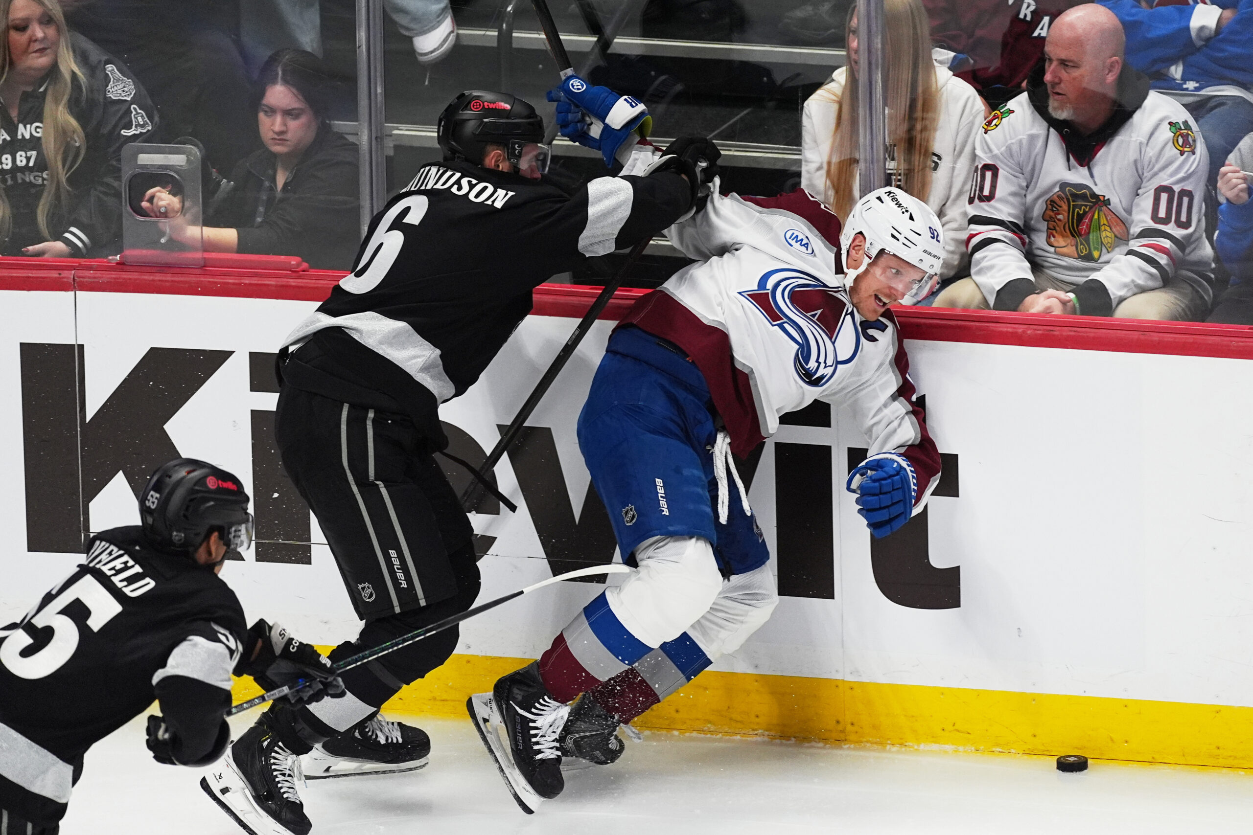 Colorado Avalanche left wing Gabriel Landeskog, right, falls while tangling...