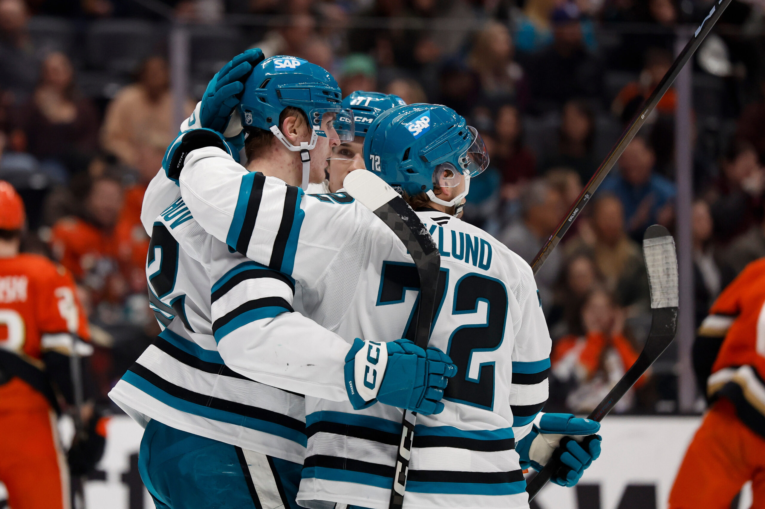 San Jose Sharks left wing Igor Chernyshov, left, is congratulated...