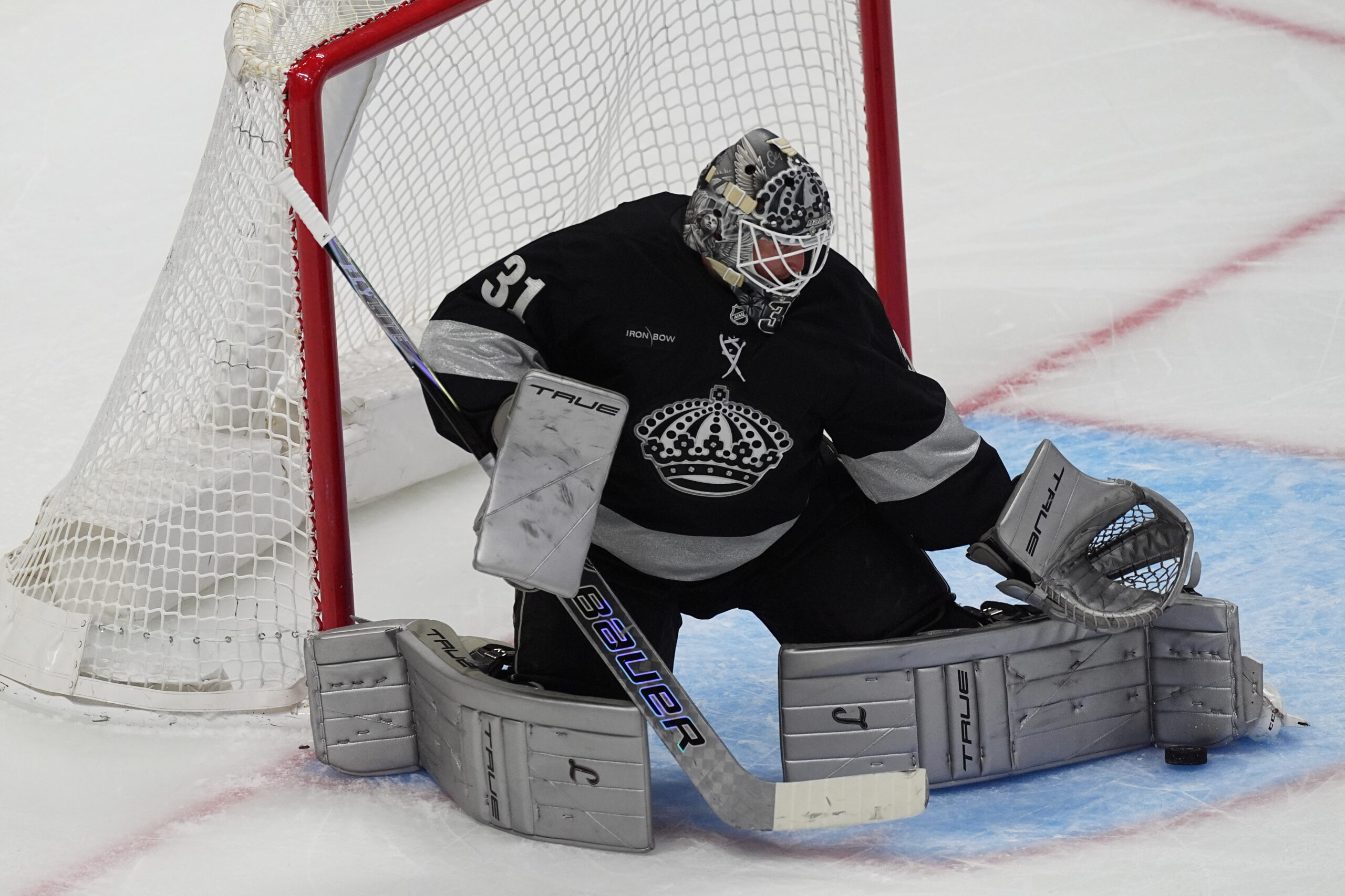 Kings goaltender Anton Forsberg makes a pad save in the...