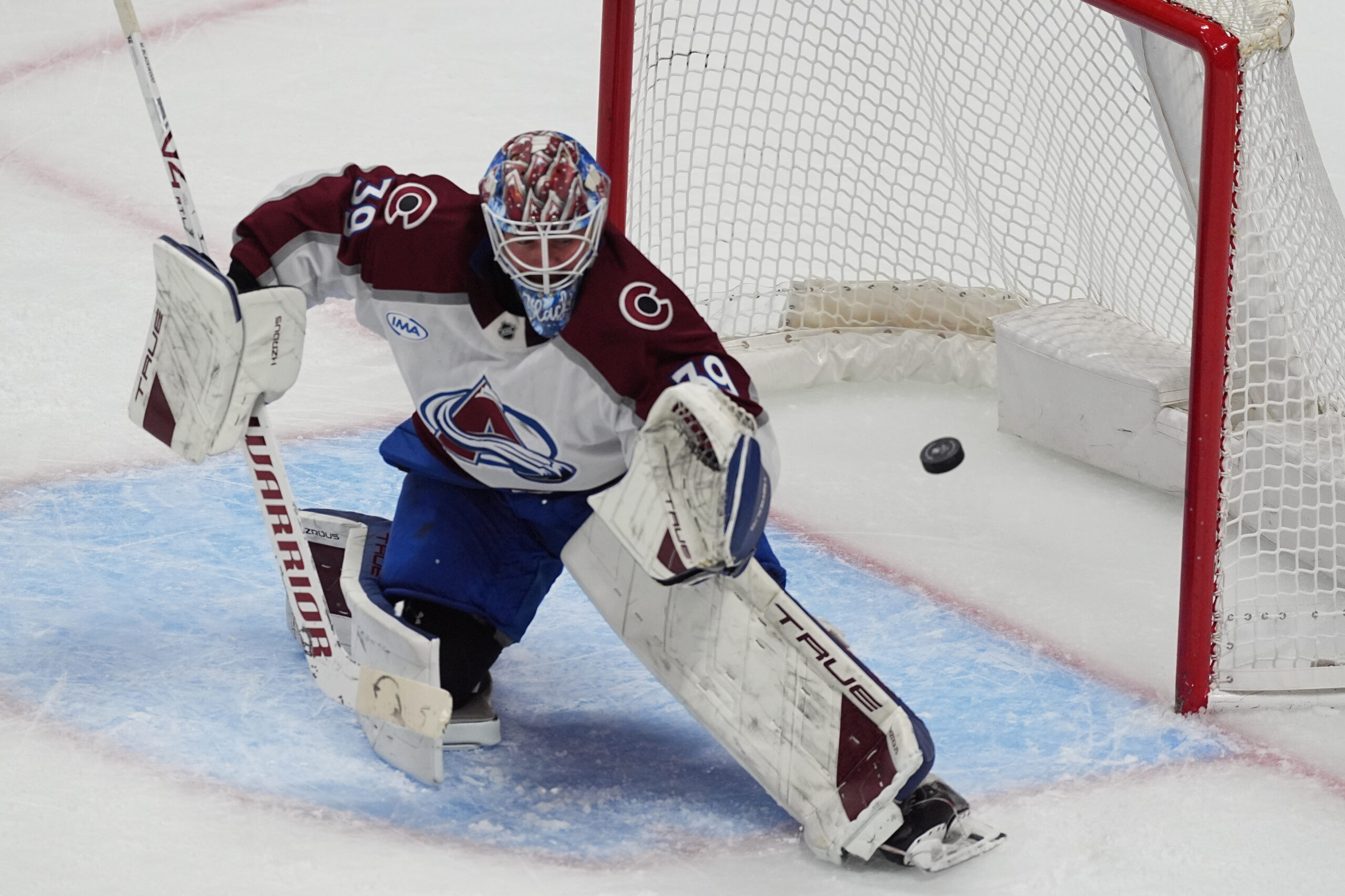 Colorado Avalanche goaltender Mackenzie Blackwood makes a glove-save of a...