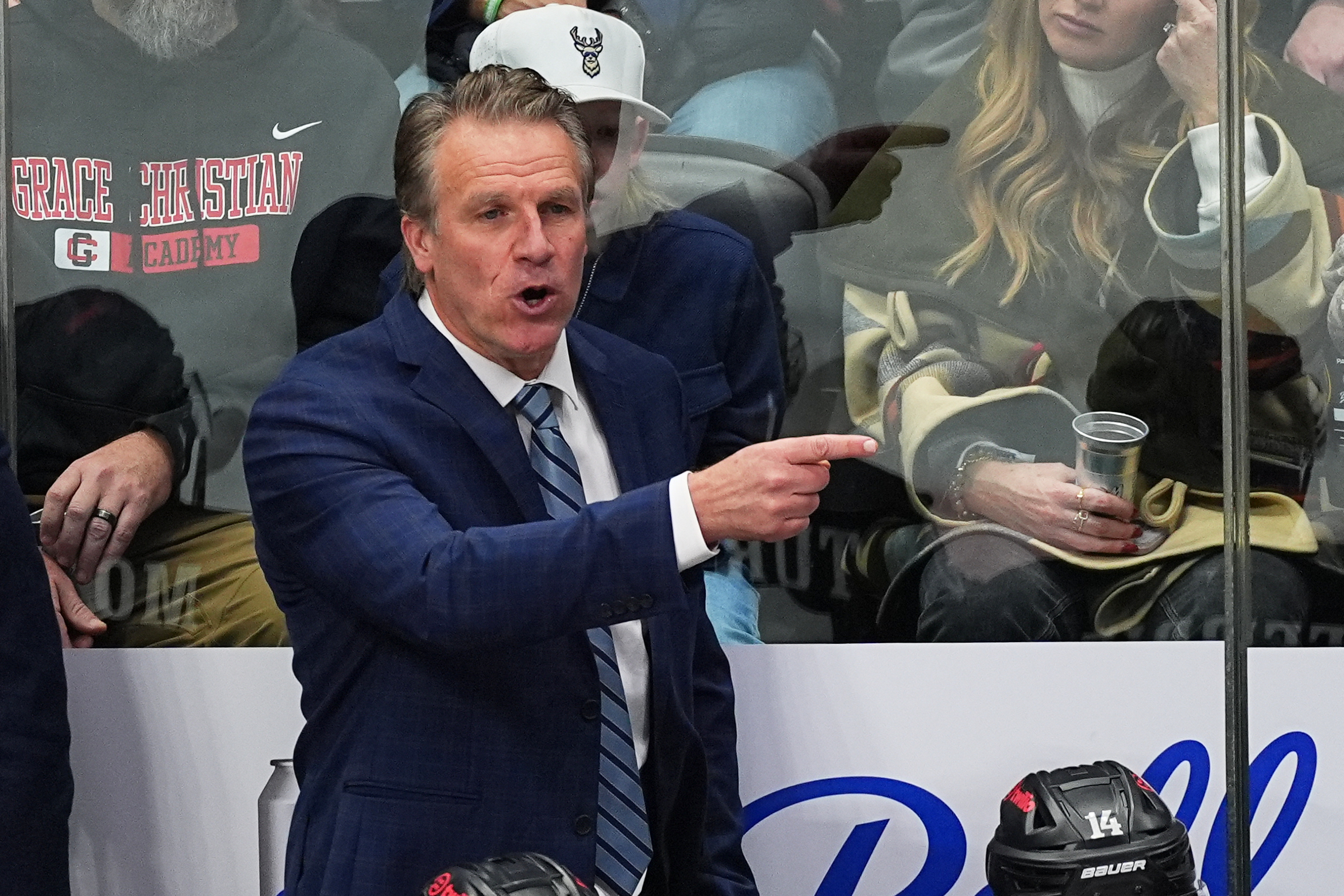 Kings head coach Jim Hiller directs his players form the...