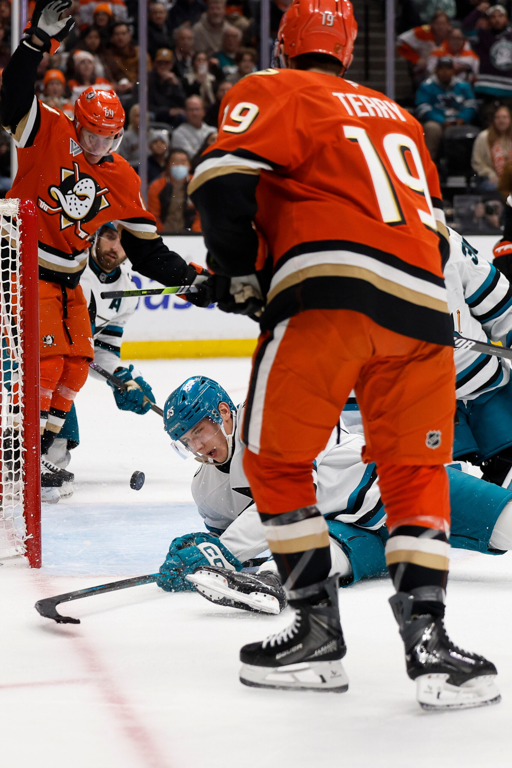 Ducks right wing Troy Terry (19) takes a shot and...