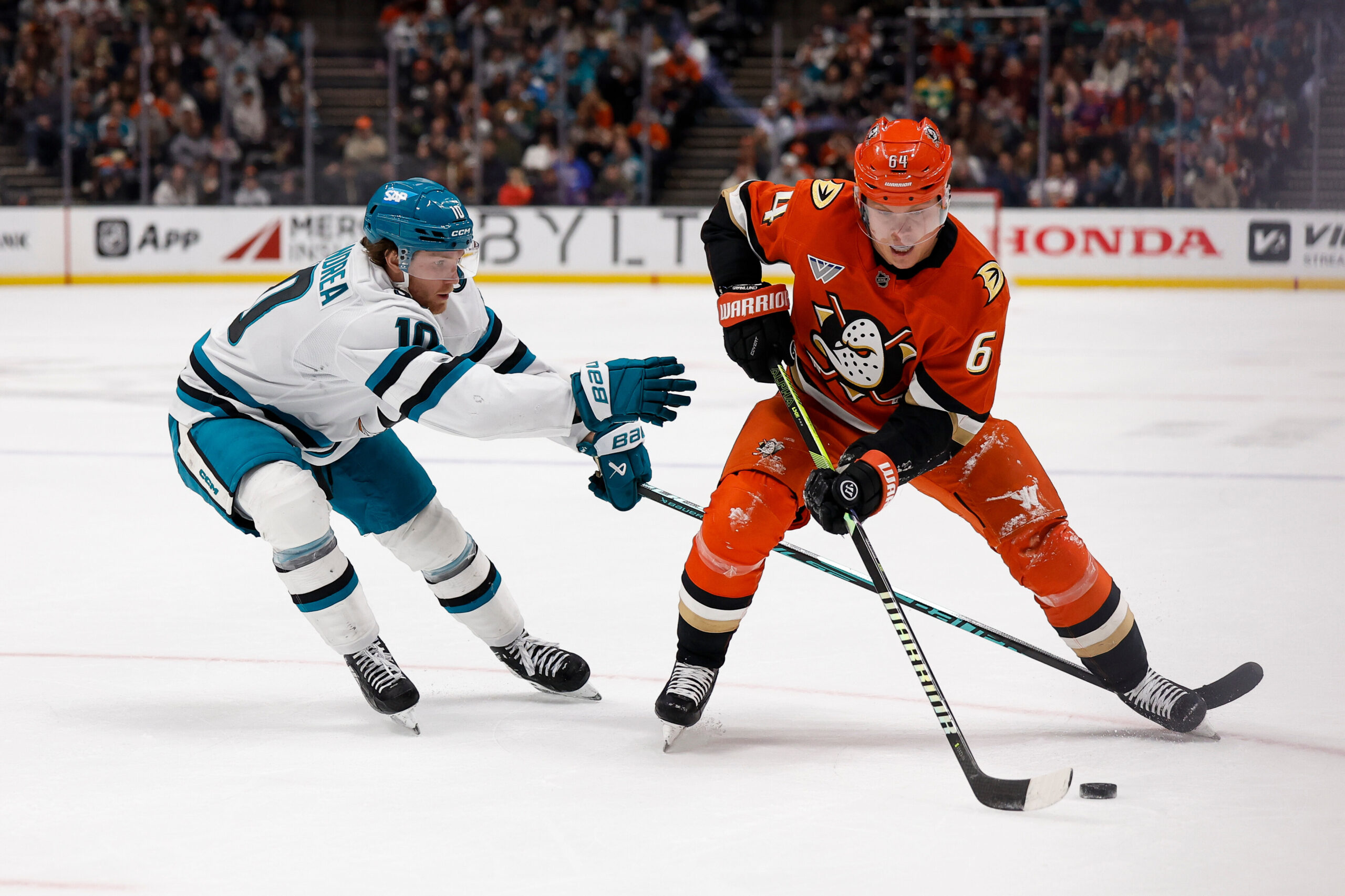 Ducks center Mikael Granlund (64) skates with the puck as...