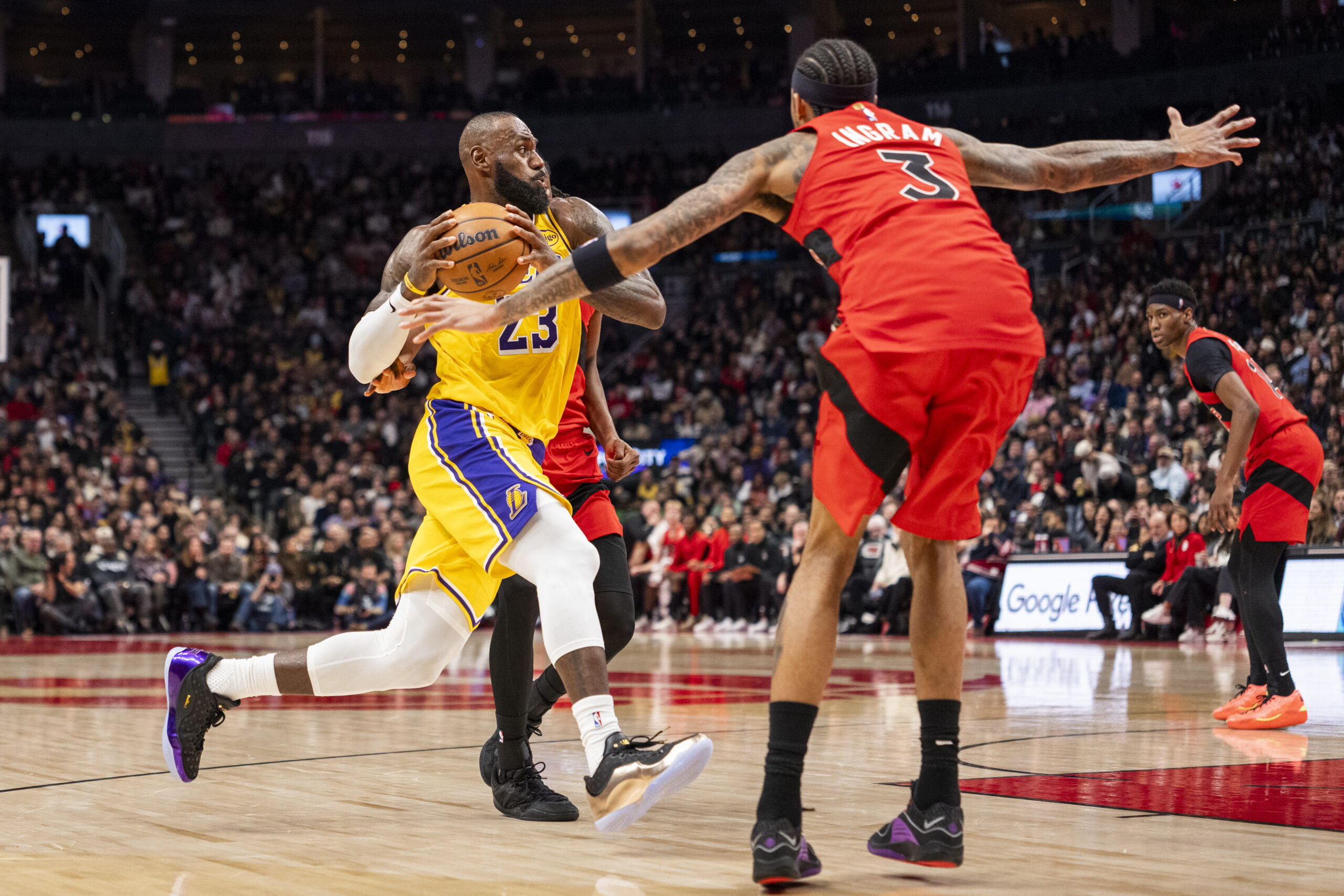 Lakers star LeBron James drives to the basket as the...