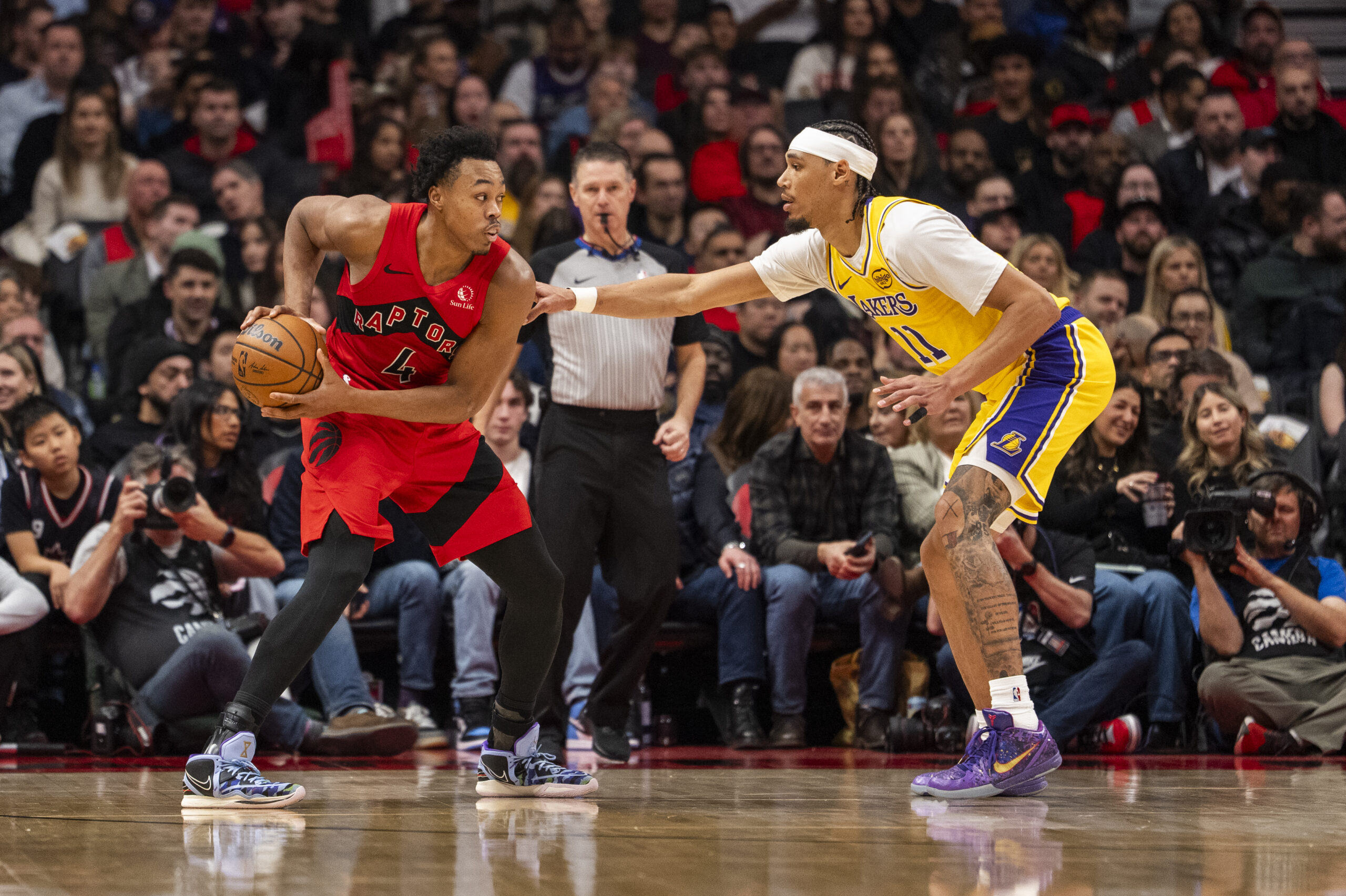The Toronto Raptors’ Scottie Barnes looks to make a play...