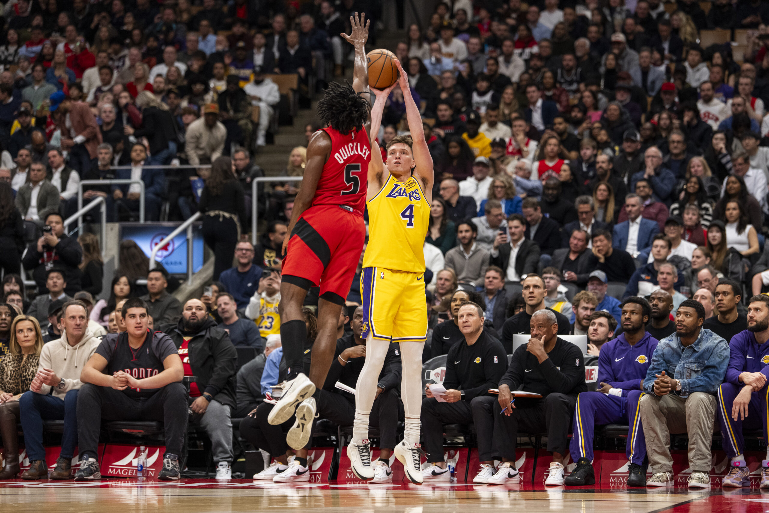 Lakers wing Dalton Knecht takes a 3-point shot as the...