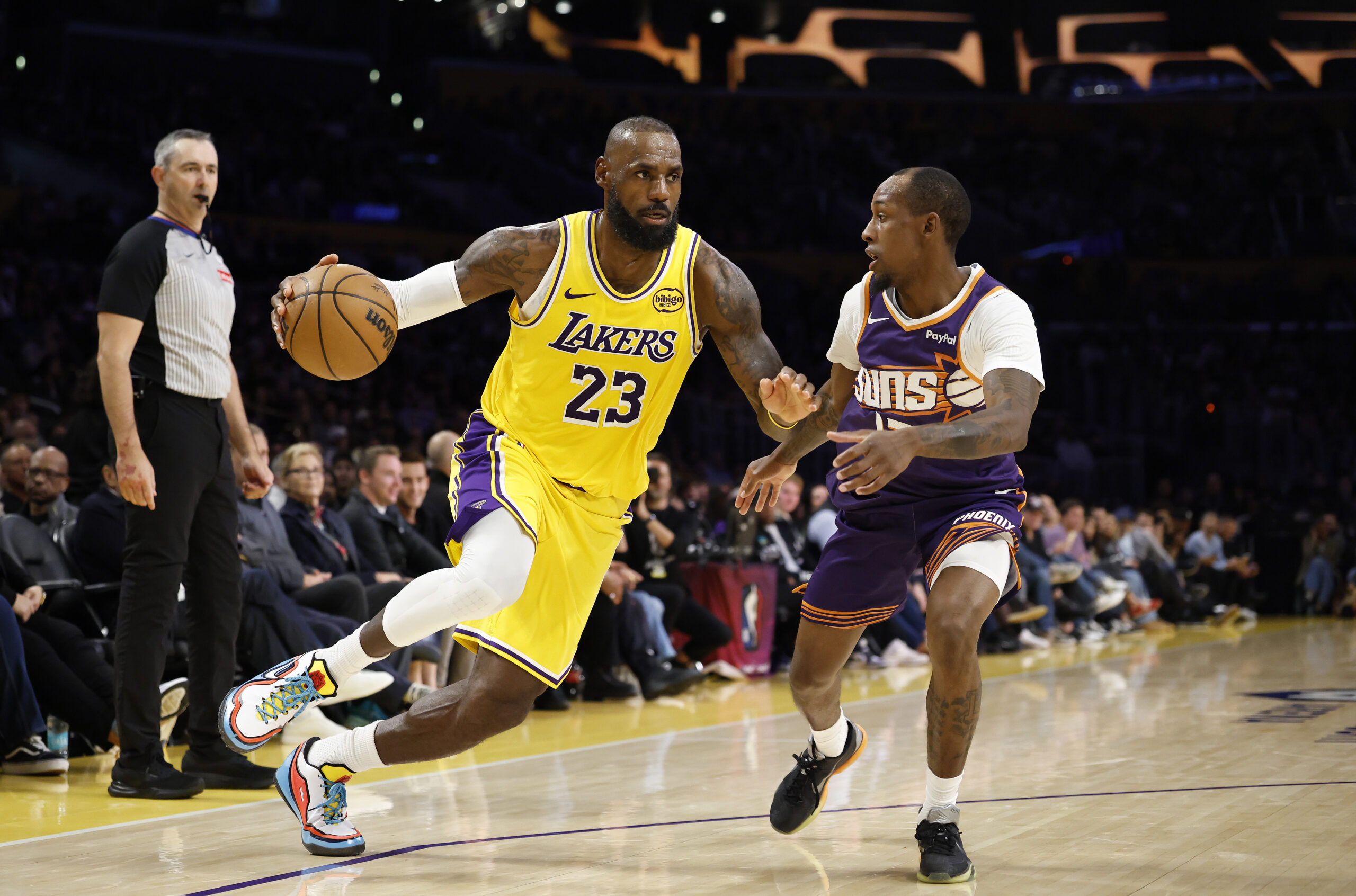 Lakers star LeBron James drives as the Phoenix Suns’ Jamaree...