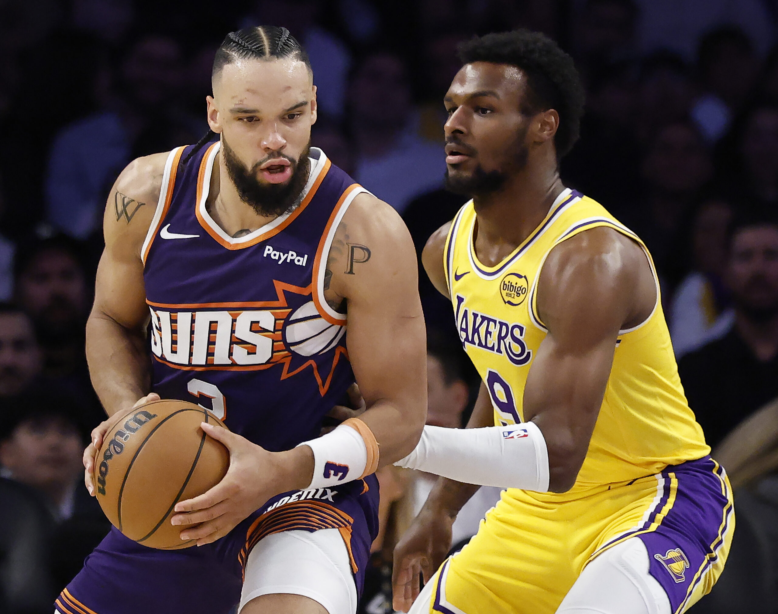 Phoenix Suns forward Dillon Brooks handles the ball as Lakers...