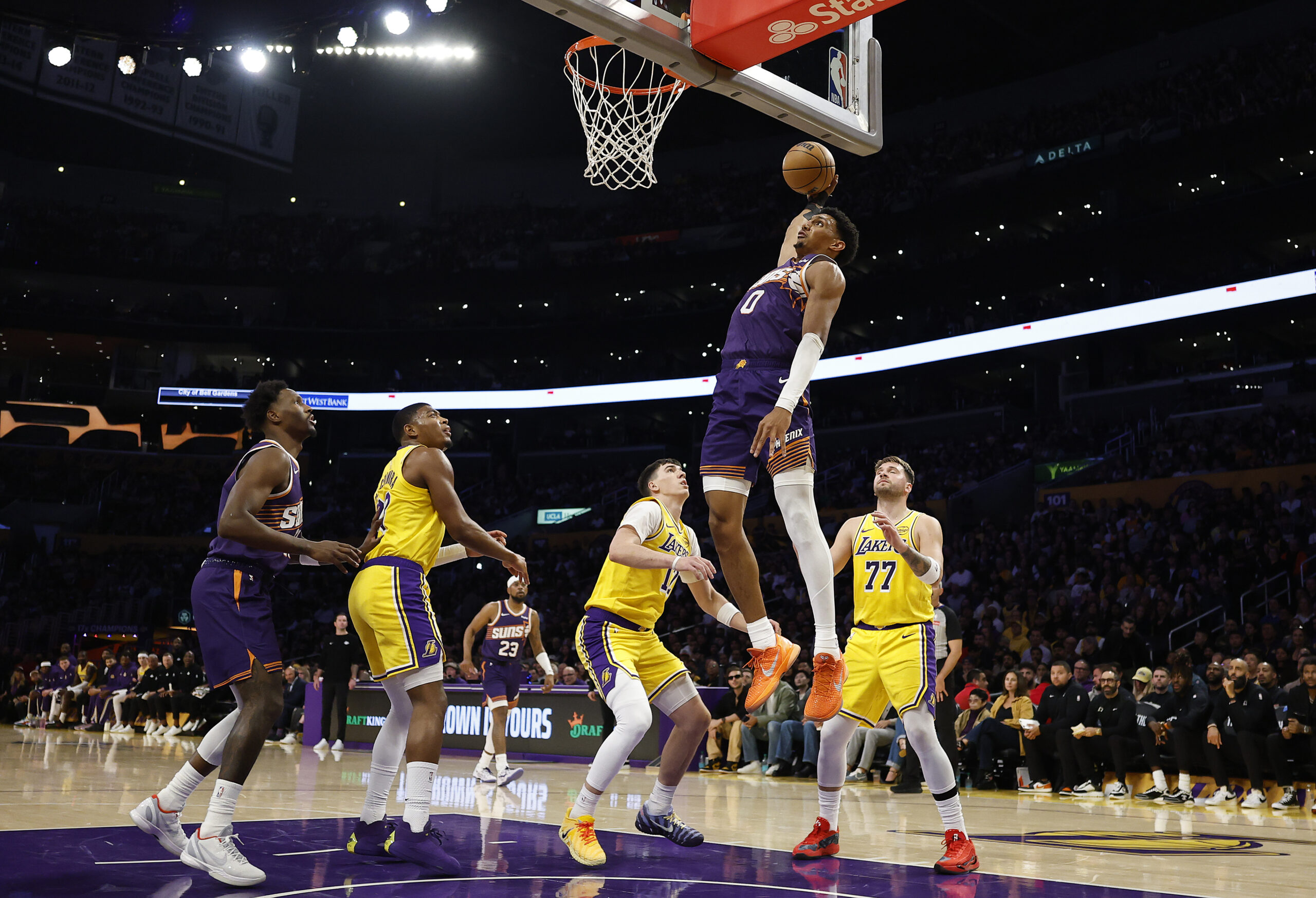 The Phoenix Suns’ Ryan Dunn soars to the basket for...