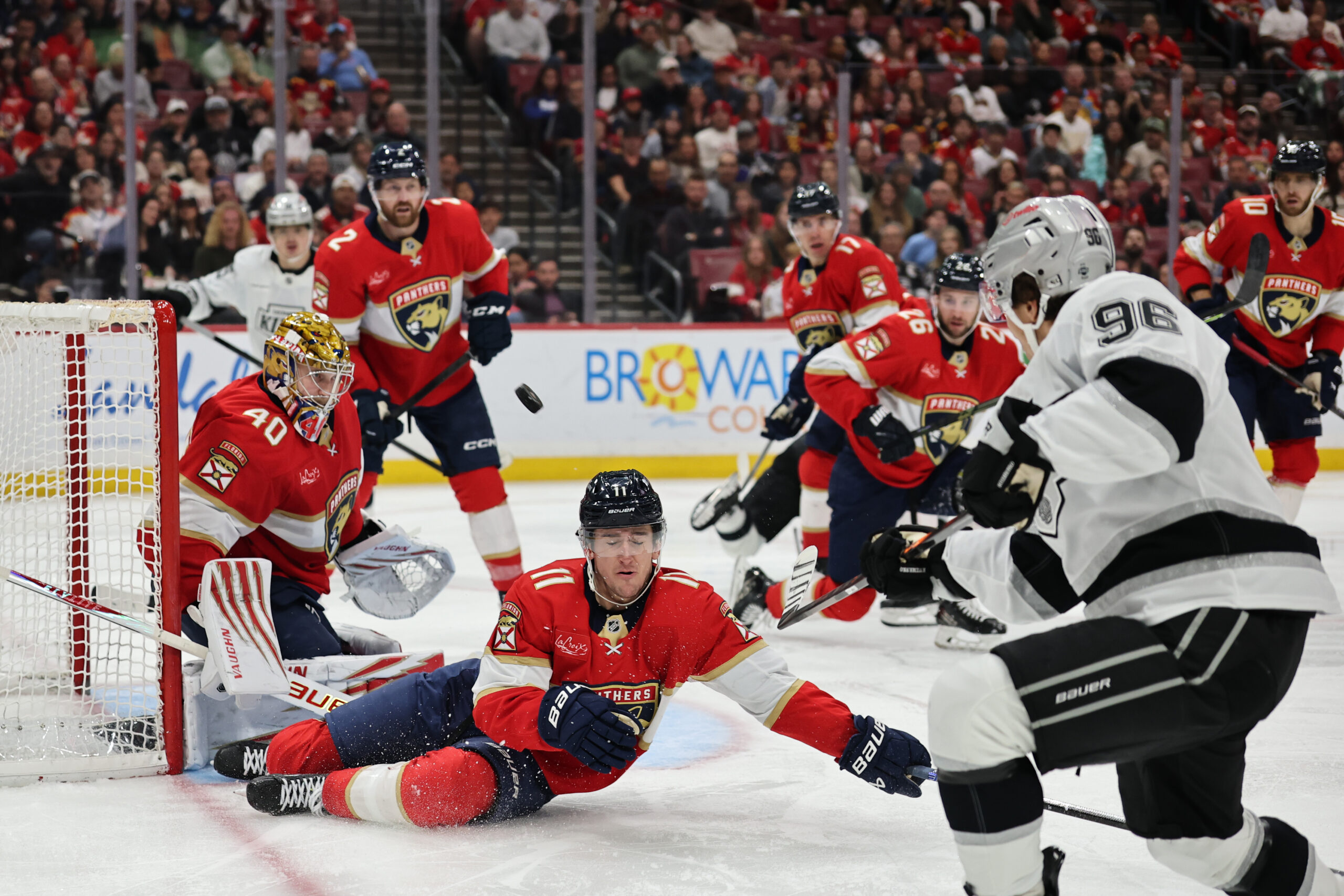 The Florida Panthers’ Mackie Samoskevich (11) defends against a shot...