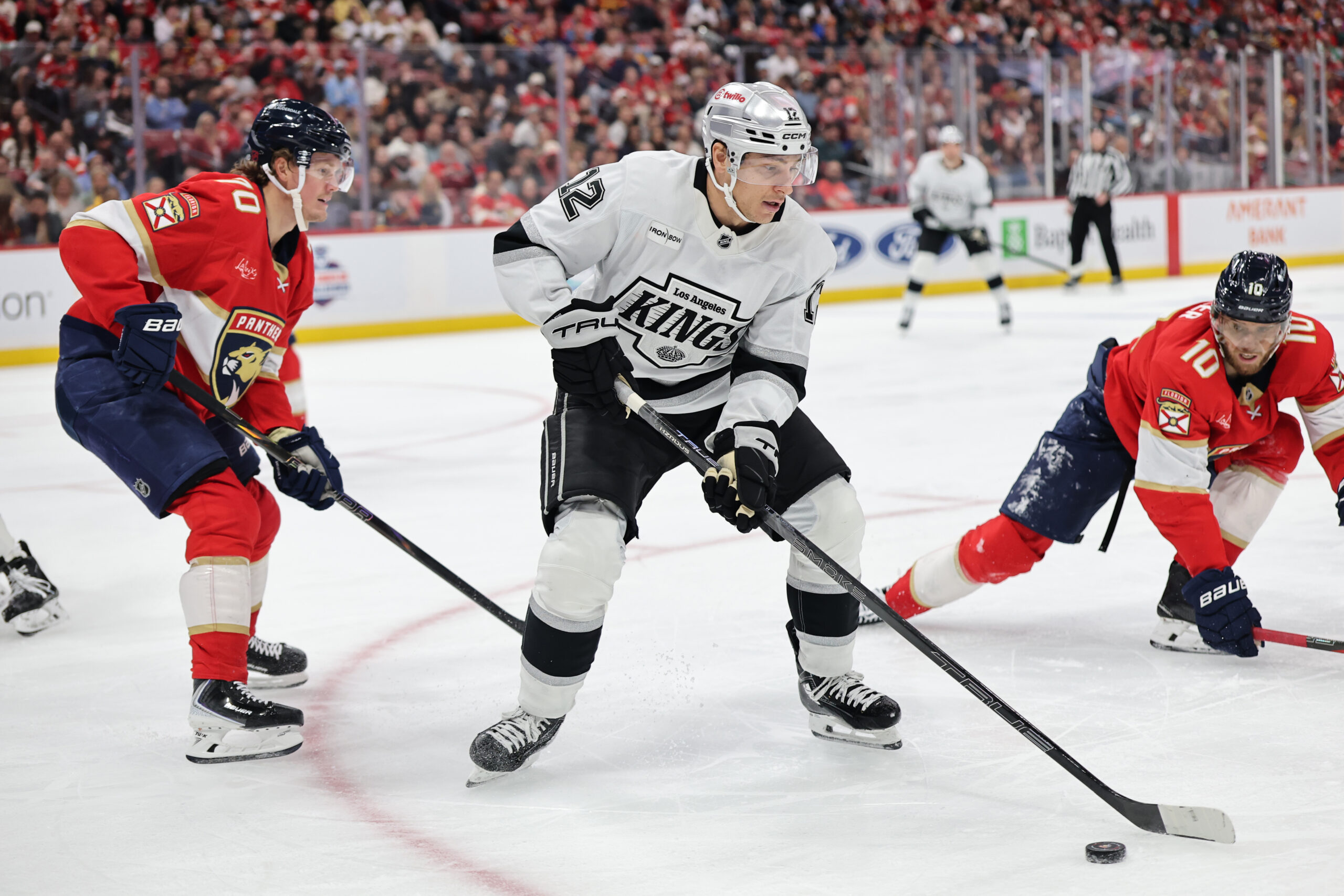 The Kings’ Trevor Moore controls the puck ahead of the...