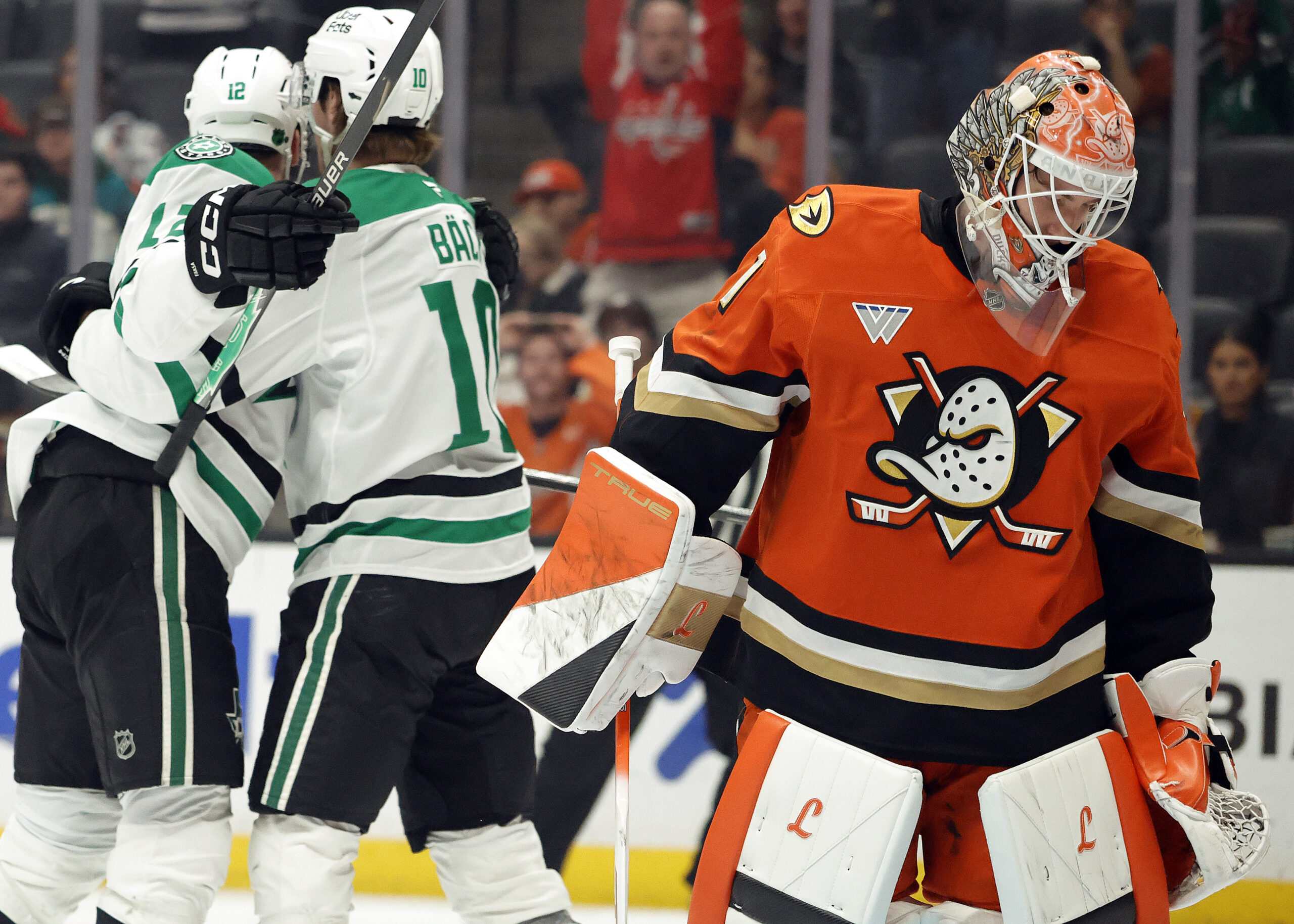 Ducks goaltender Lukas Dostal, right, shows his frustration after giving...