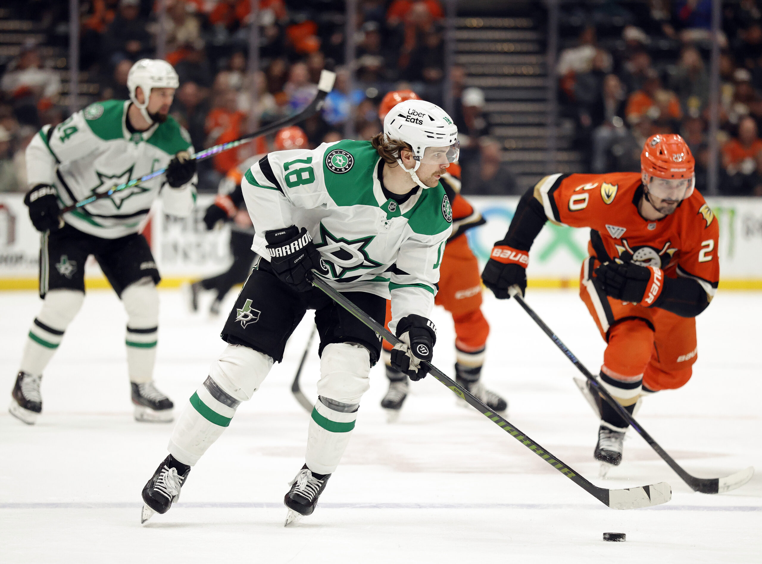 The Dallas Stars’ Sam Steel skates with the puck as...