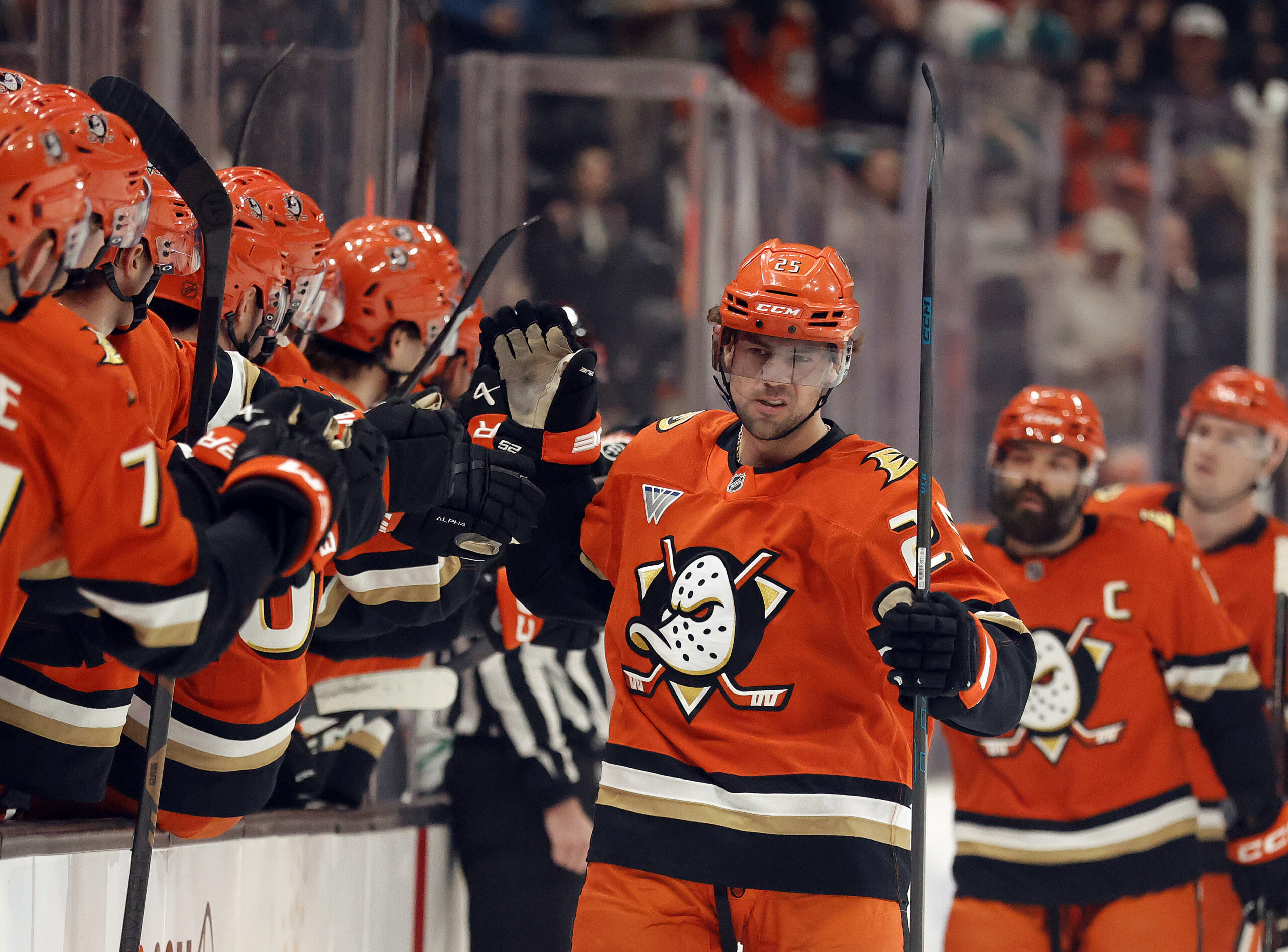The Ducks’ Ryan Poehling (25) celebrates with teammates on the...