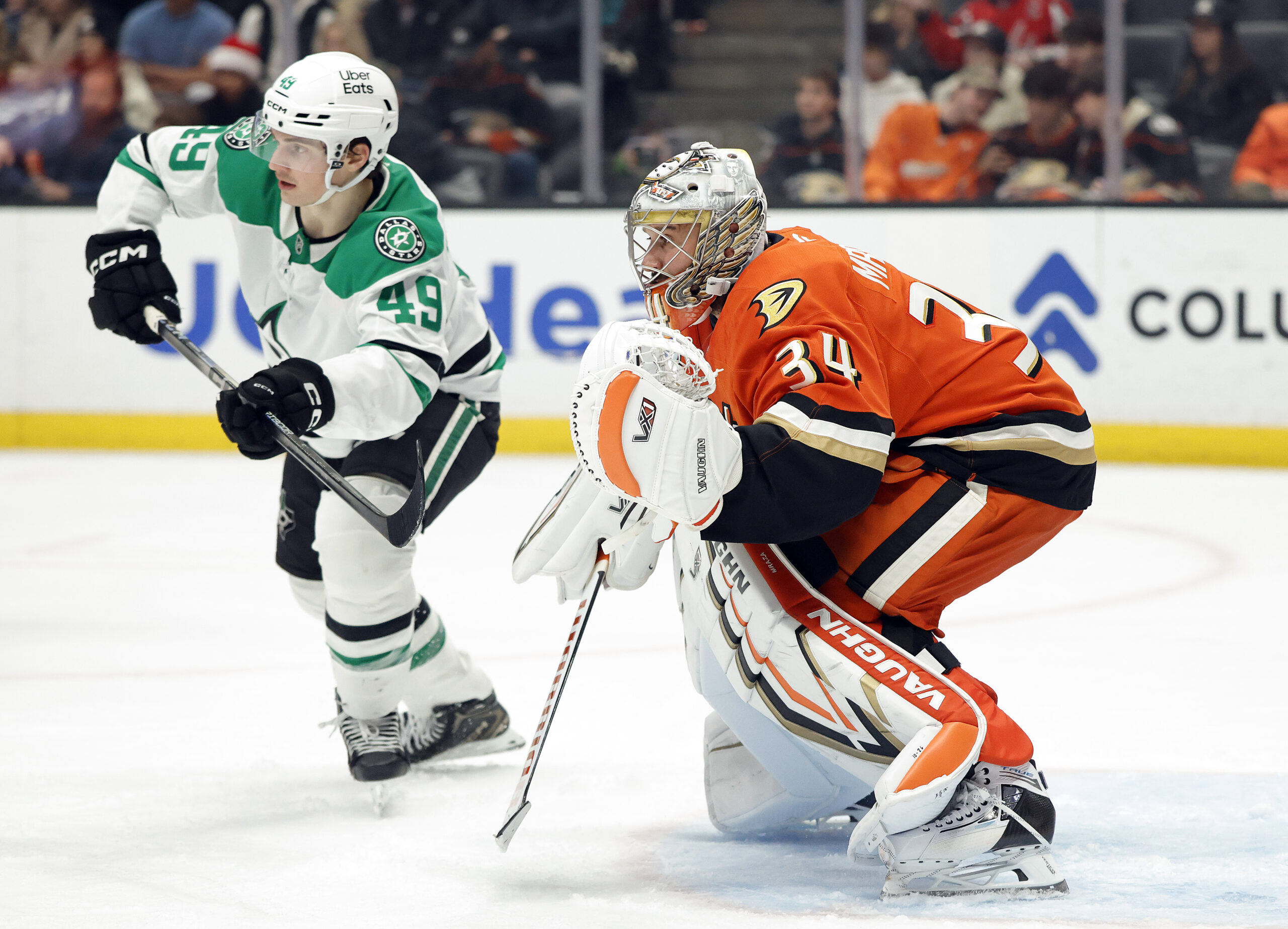 Ducks goaltender Petr Mrazek, right, defends his net as the...