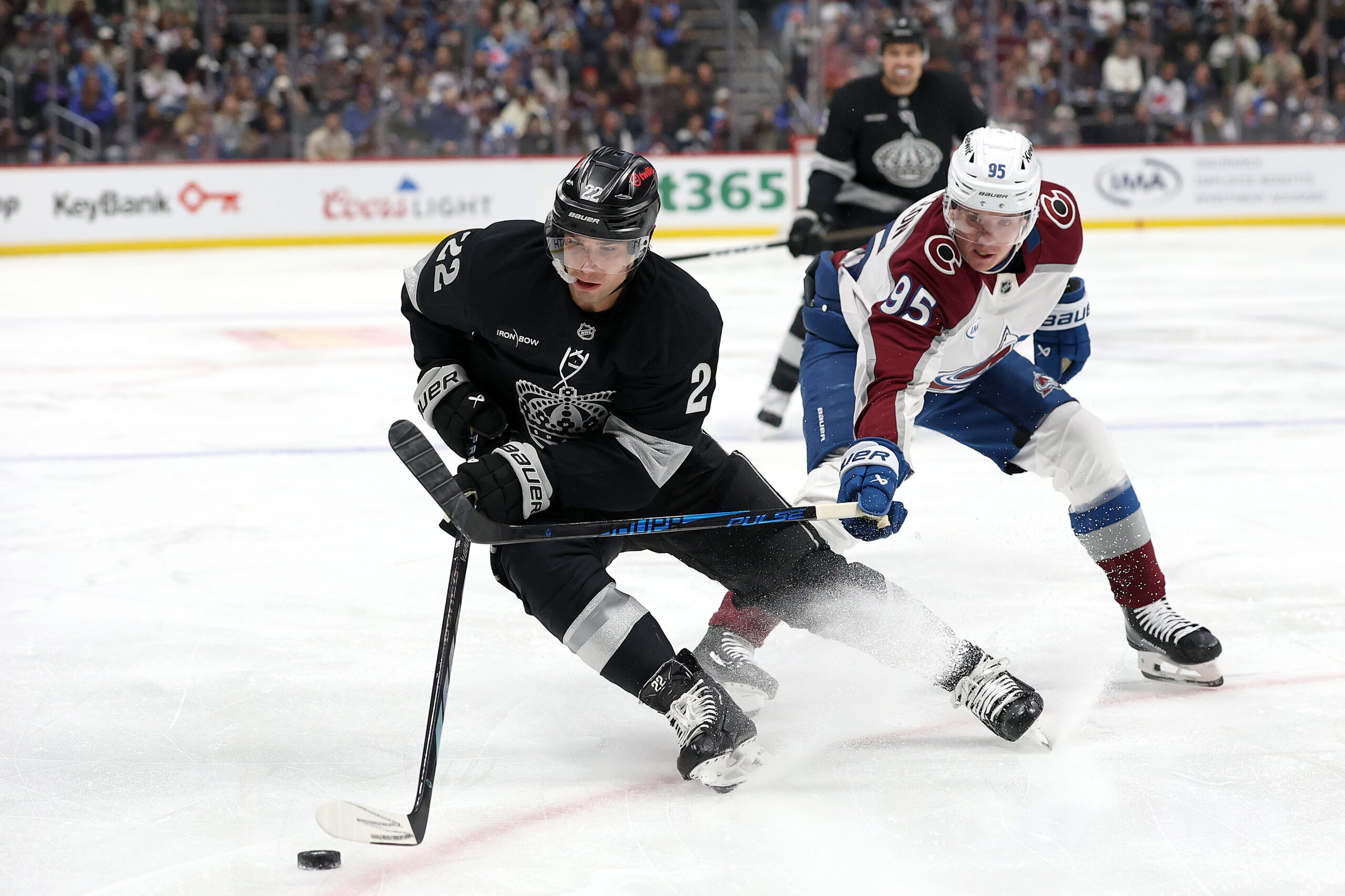 The Kings’ Kevin Fiala advances the puck in front of...