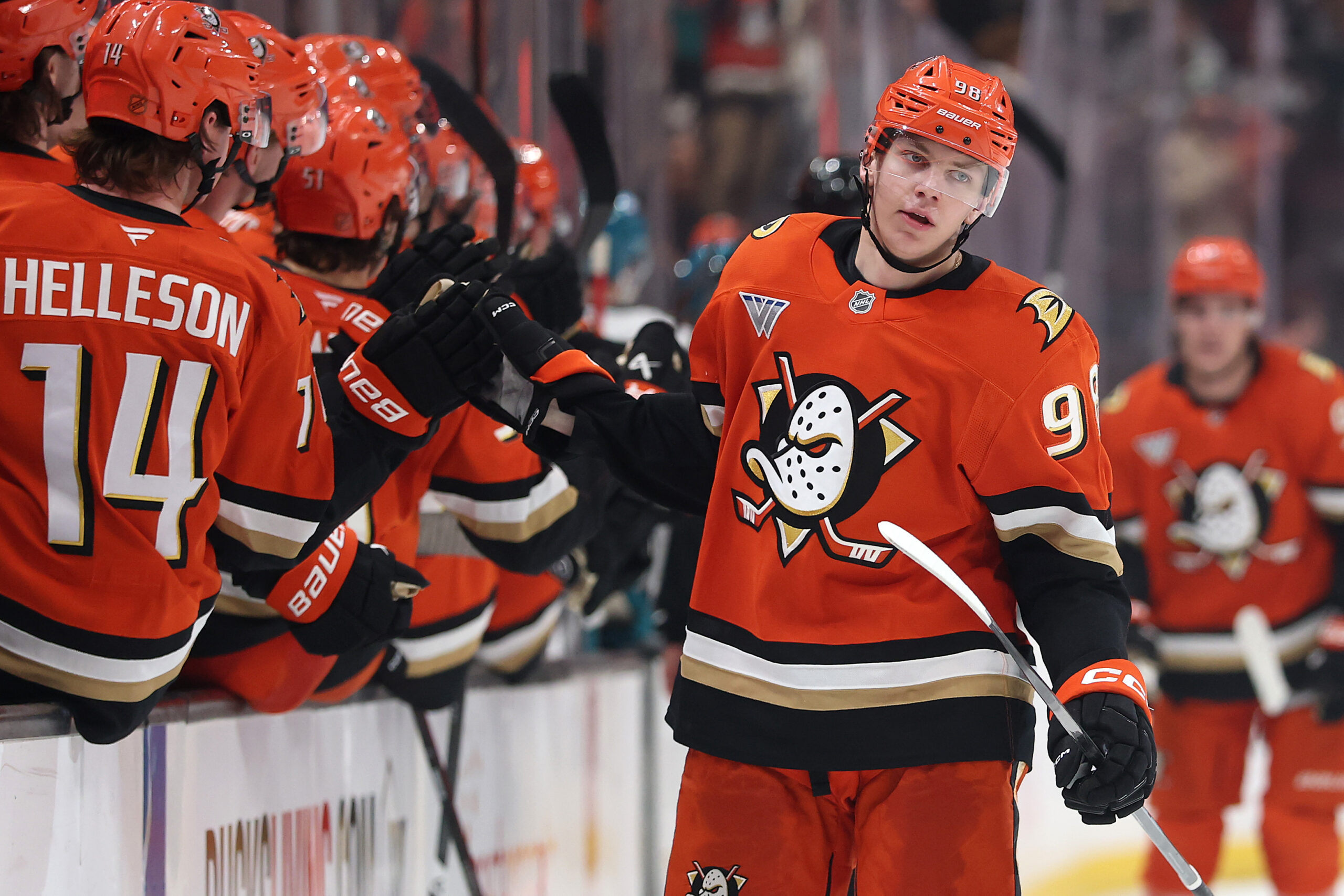 The Ducks’ Pavel Mintyukov is congratulated at the bench after...