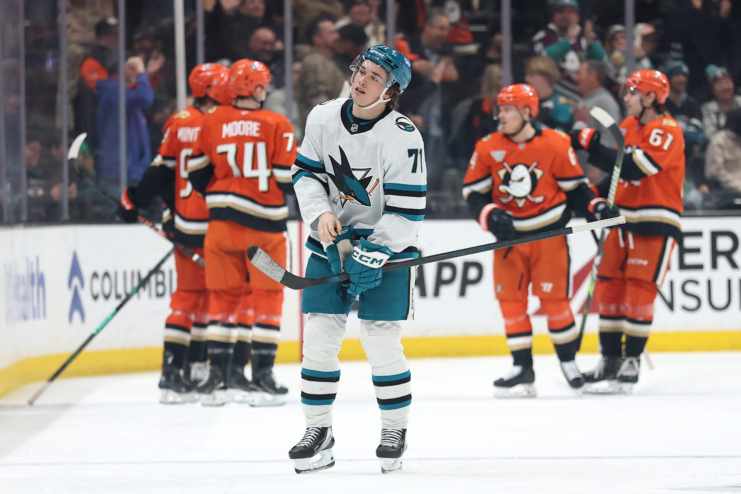 The San Jose Sharks’ Macklin Celebrini looks on after a...