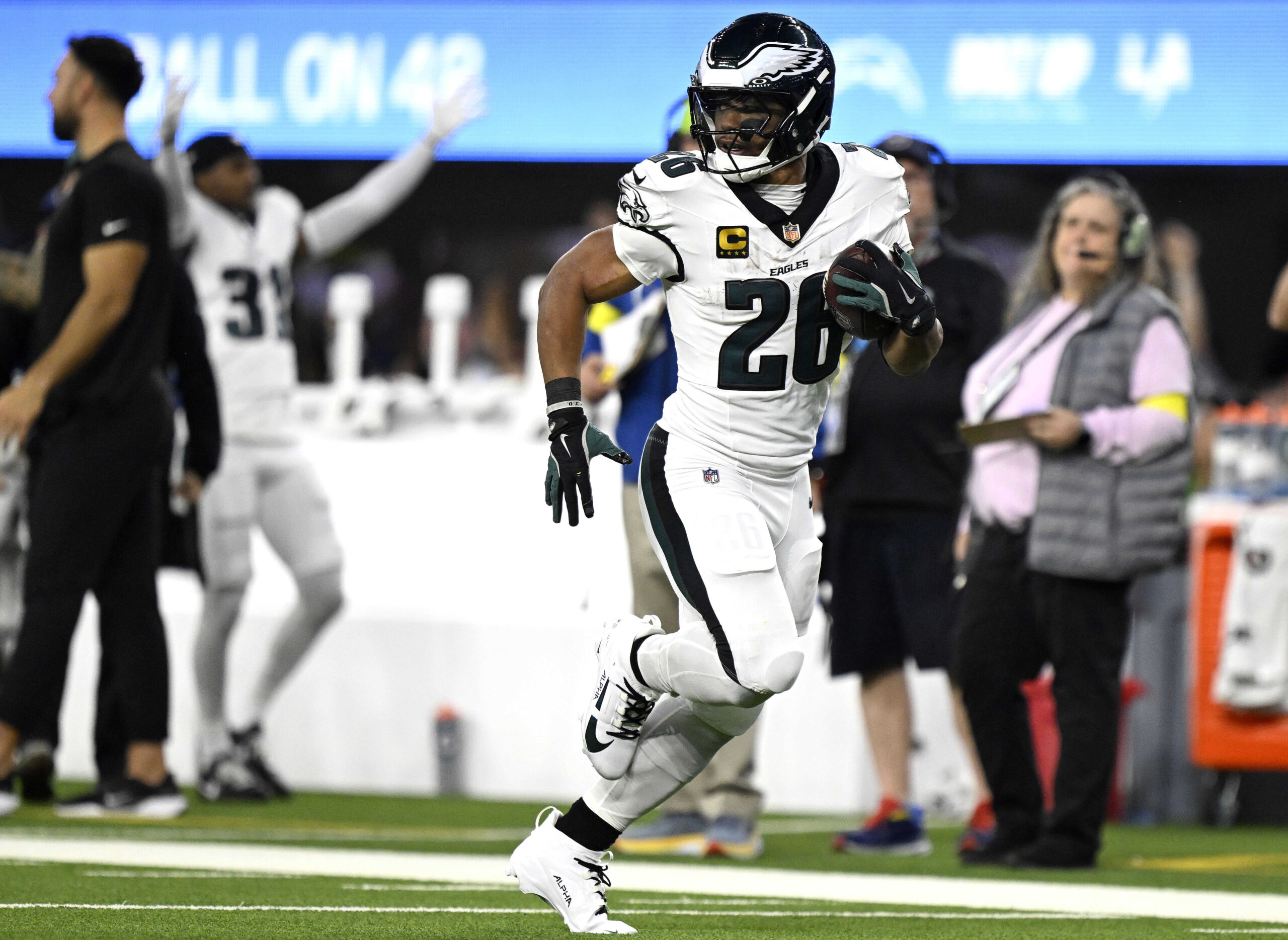 Philadelphia Eagles running back Saquon Barkley breaks away for a...