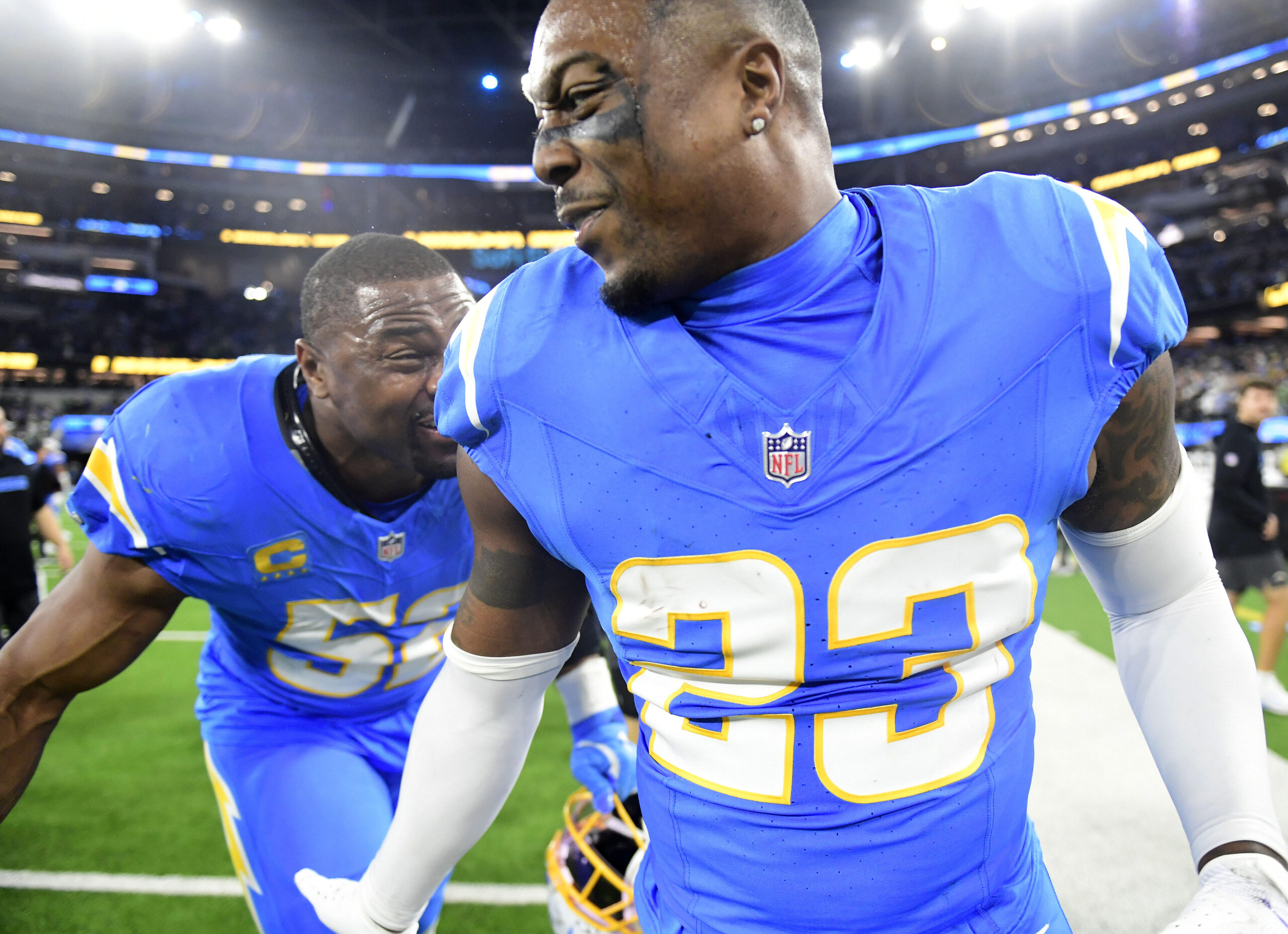 Chargers safety Tony Jefferson, right, celebrates with linebacker/edge rusher Khalil...