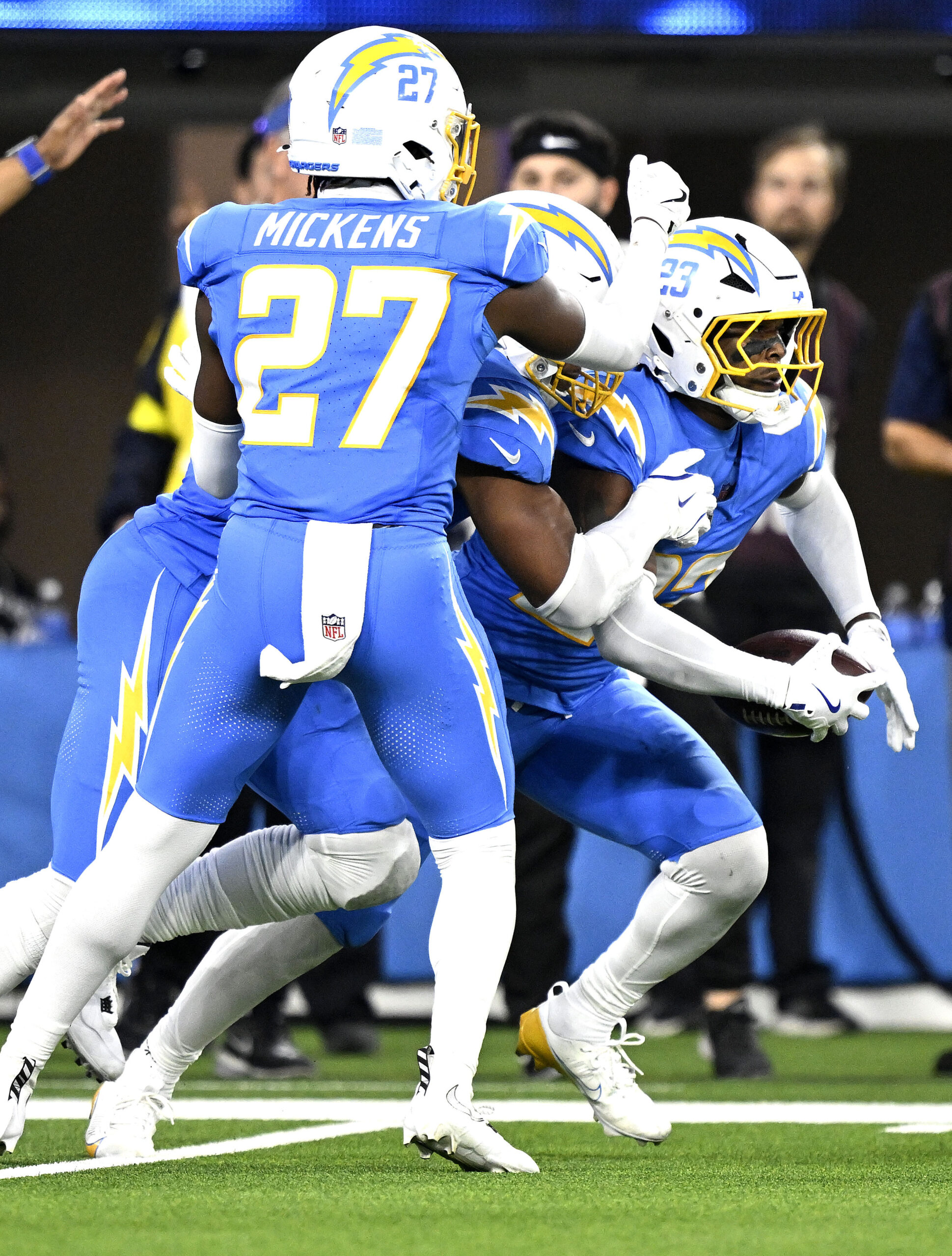 Chargers safety Tony Jefferson (23) celebrates with teammates, including safety...