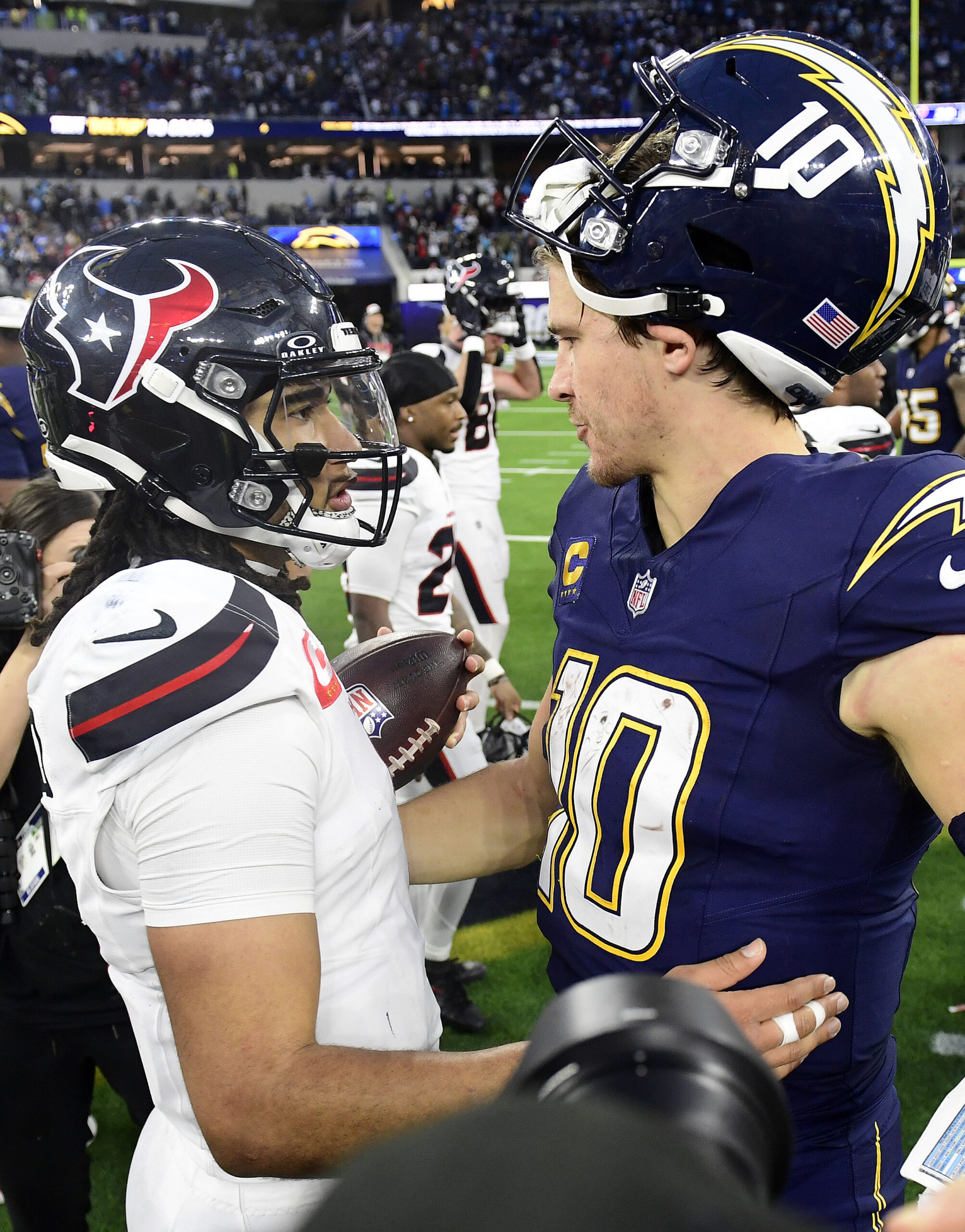 Texans quarterback C.J. Stroud, left, and Chargers quarterbac Justin Herbert,...