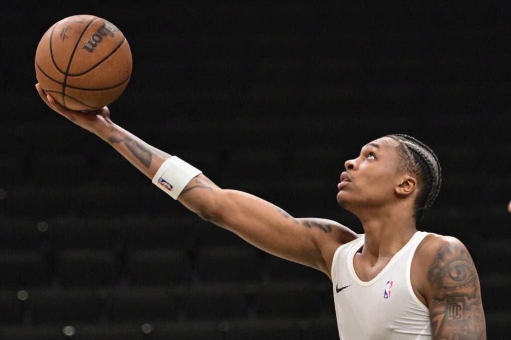 Oct 9, 2025; Milwaukee, Wisconsin, USA; Milwaukee Bucks forward Tyler Smith (21) warms up before game against the Detroit Pistons at Fiserv Forum. Mandatory Credit: Benny Sieu-Imagn Images