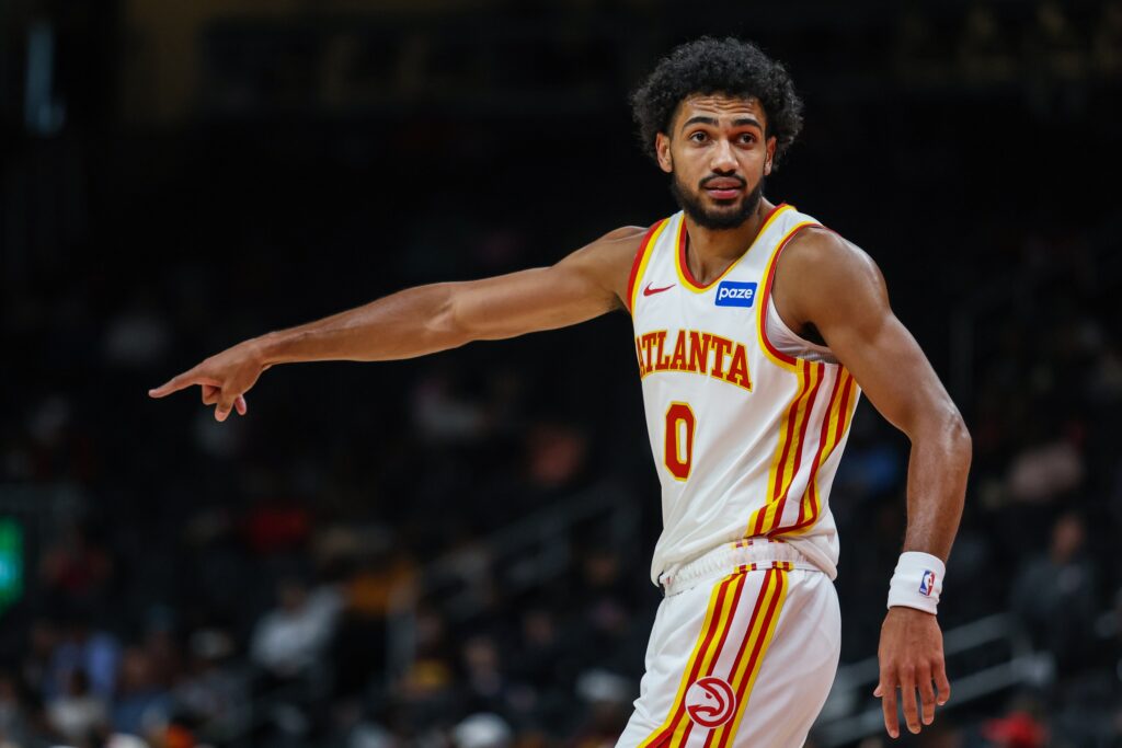 Oct 13, 2025; Atlanta, Georgia, USA; Atlanta Hawks forward Jacob Toppin (0) points while talking to a teammate during the game against the Miami Heat during the first quarter at State Farm Arena. Mandatory Credit: Jordan Godfree-Imagn Images