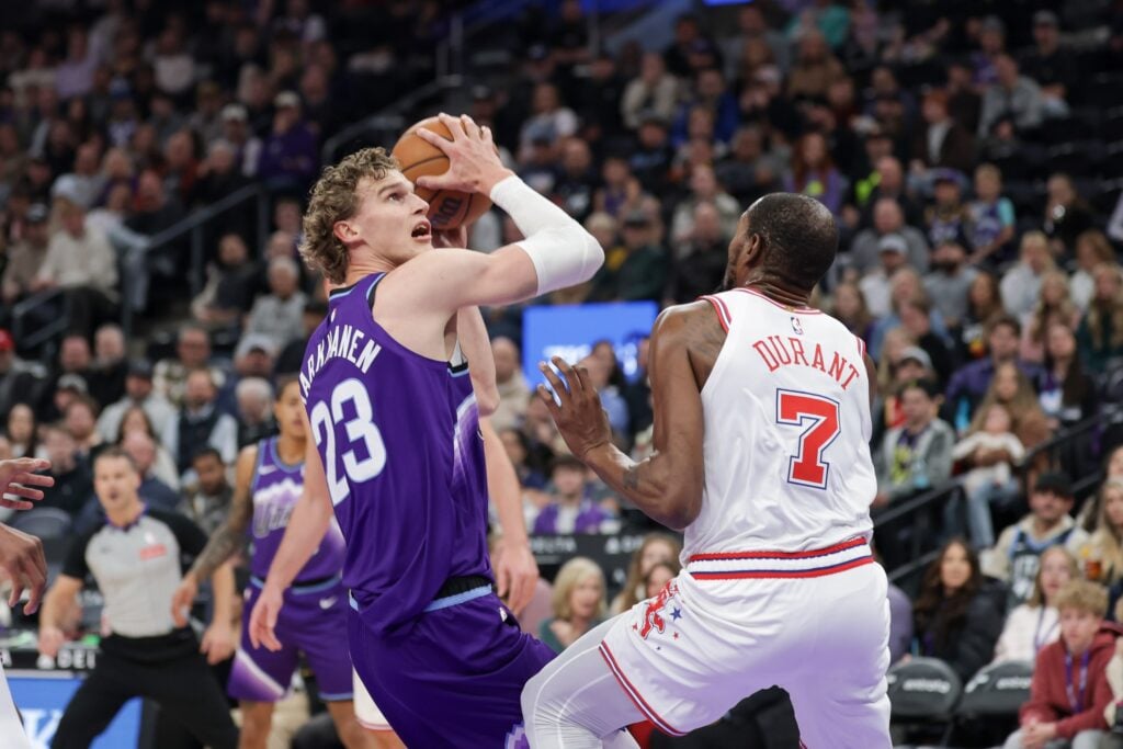  Utah Jazz forward Lauri Markkanen (23) looks to shoot over Houston Rockets forward Kevin Durant (7) during the first quarter at Delta Center.