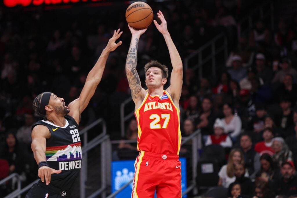 Atlanta Hawks guard Vit Krejci (27) shoots over Denver Nuggets forward Zeke Nnaji (22) in the second quarter at State Farm Arena.