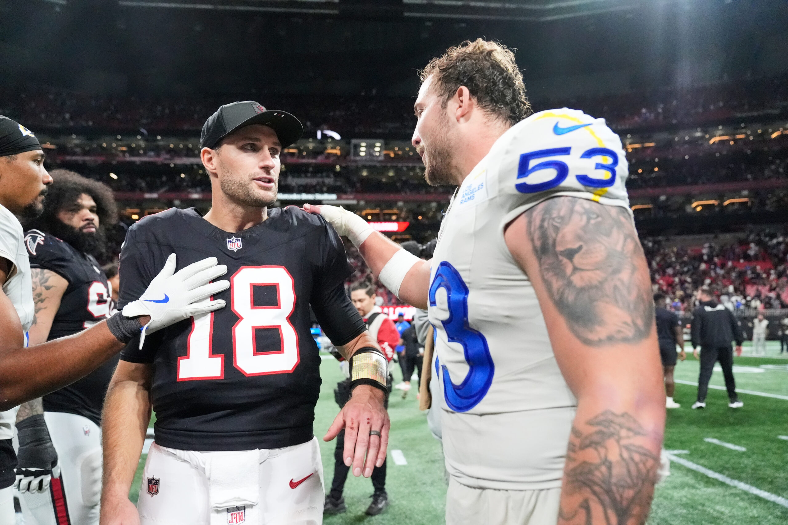 Atlanta Falcons quarterback Kirk Cousins (18) greets Rams linebacker Nate...
