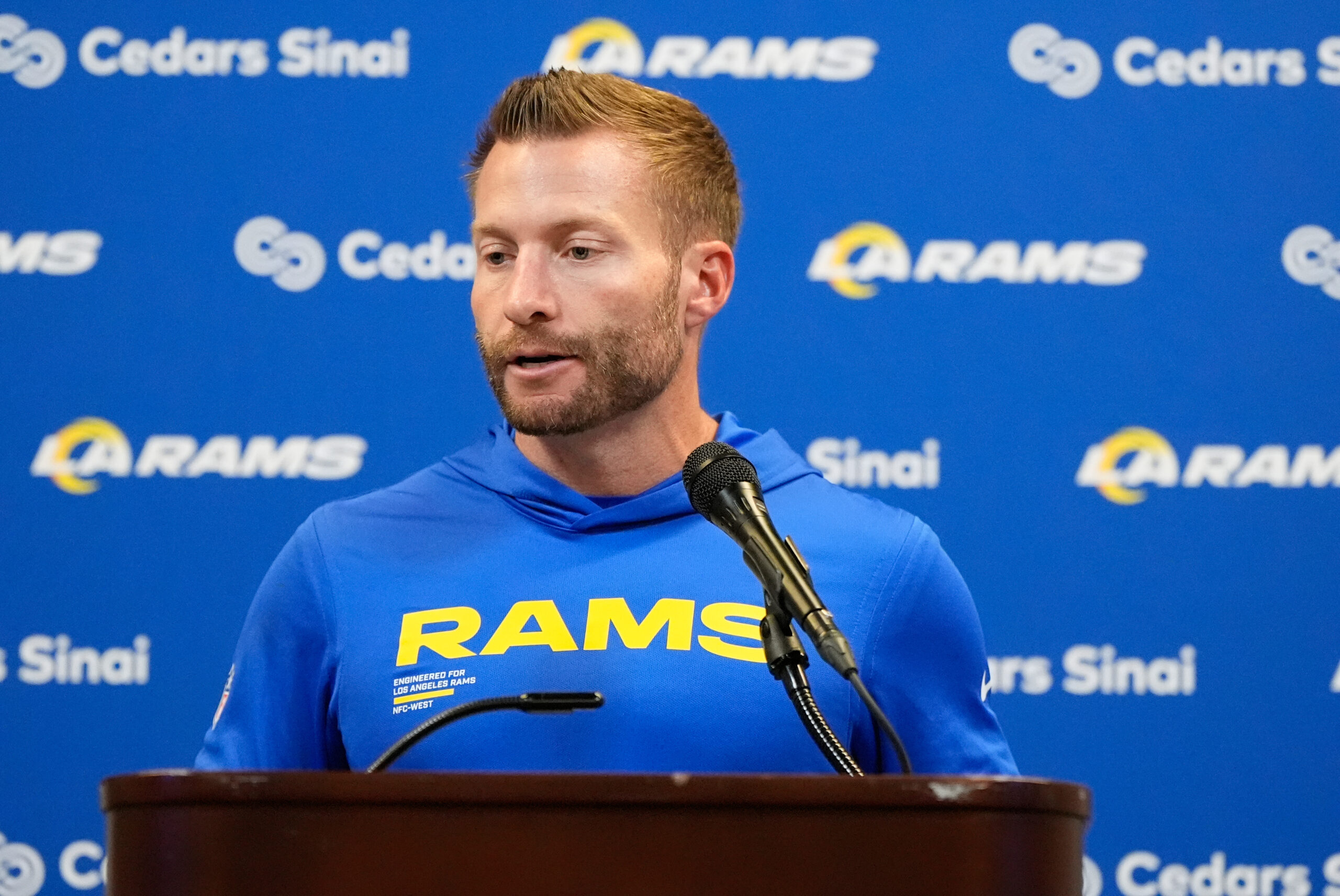 Rams head coach Sean McVay talks to reporters after an...