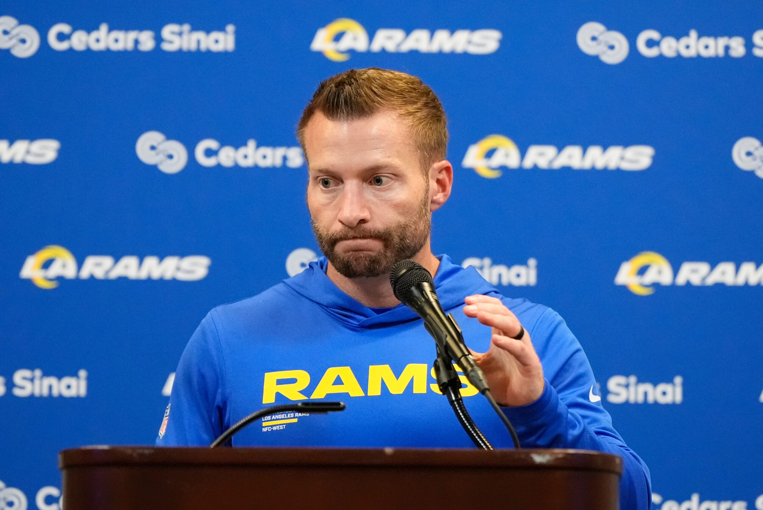 Rams head coach Sean McVay talks to reporters after an...