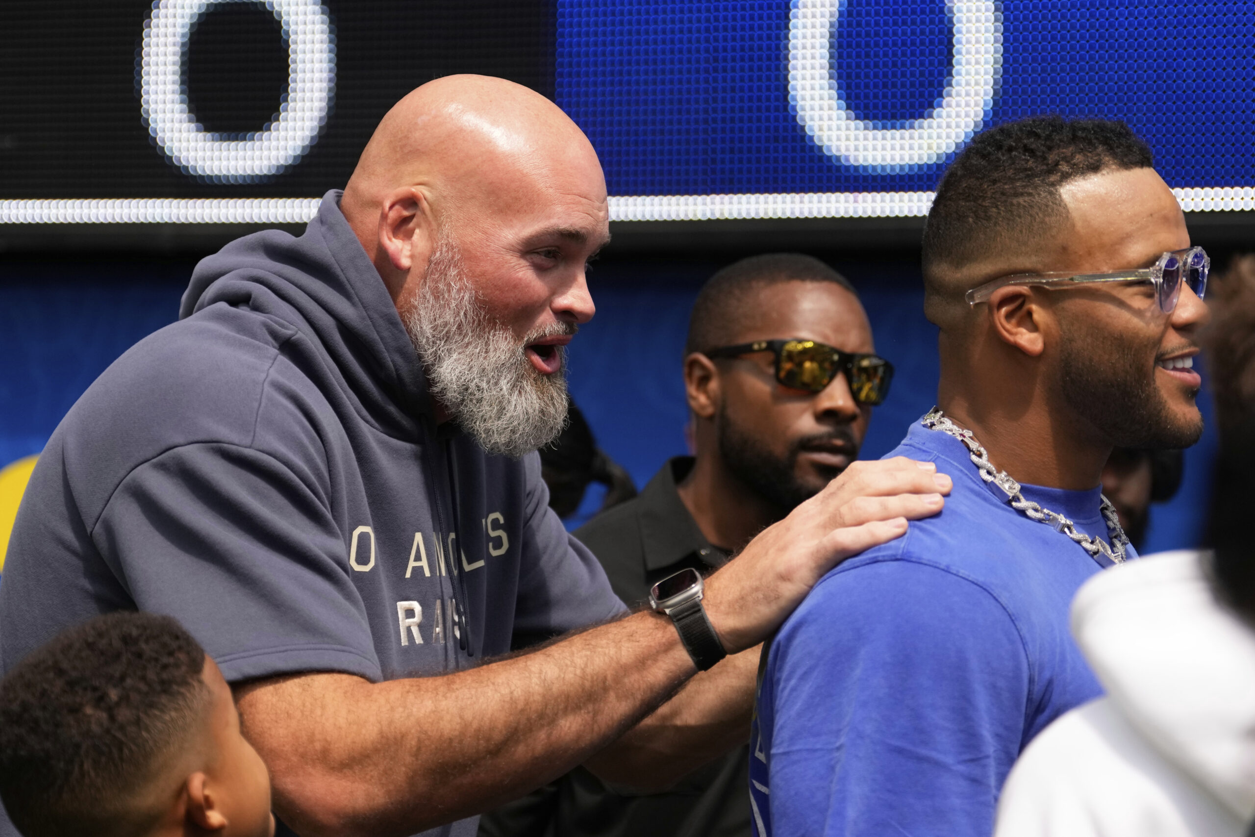 Former Rams players Andrew Whitworth, left, and Aaron Donald, right,...