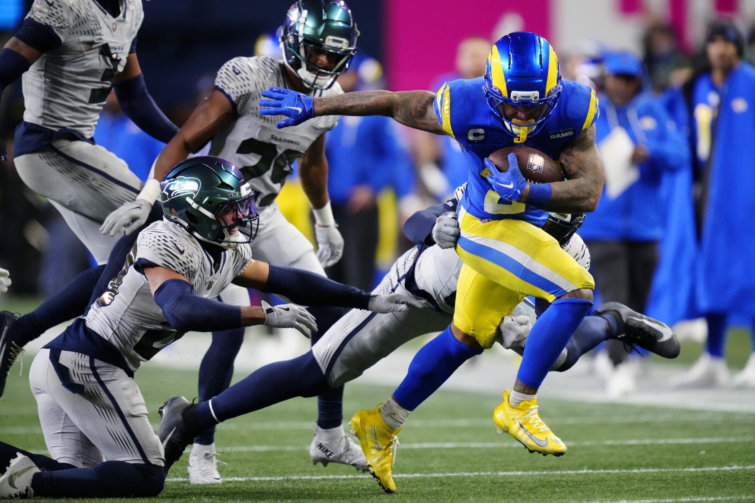 Rams running back Kyren Williams (23) runs with the ball...