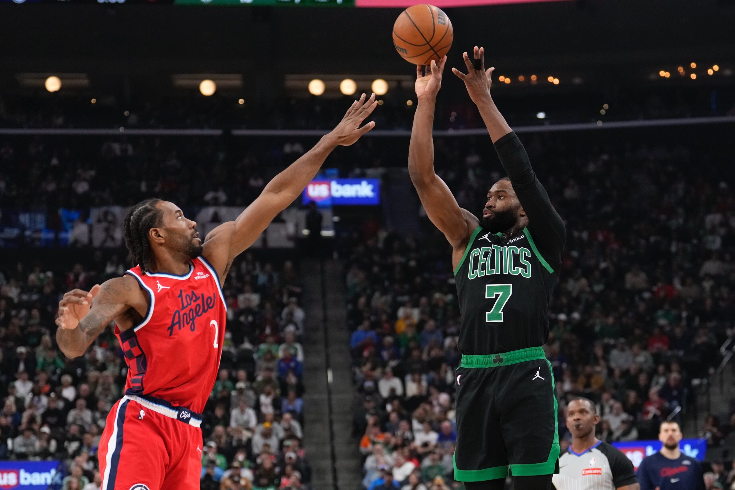 Boston Celtics guard Jaylen Brown, right, shoots a as Clippers...